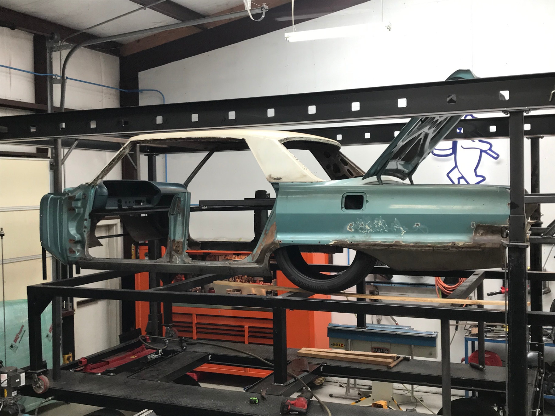 Body up on the rotisserie so the new Morrison chassis can be built underneath.