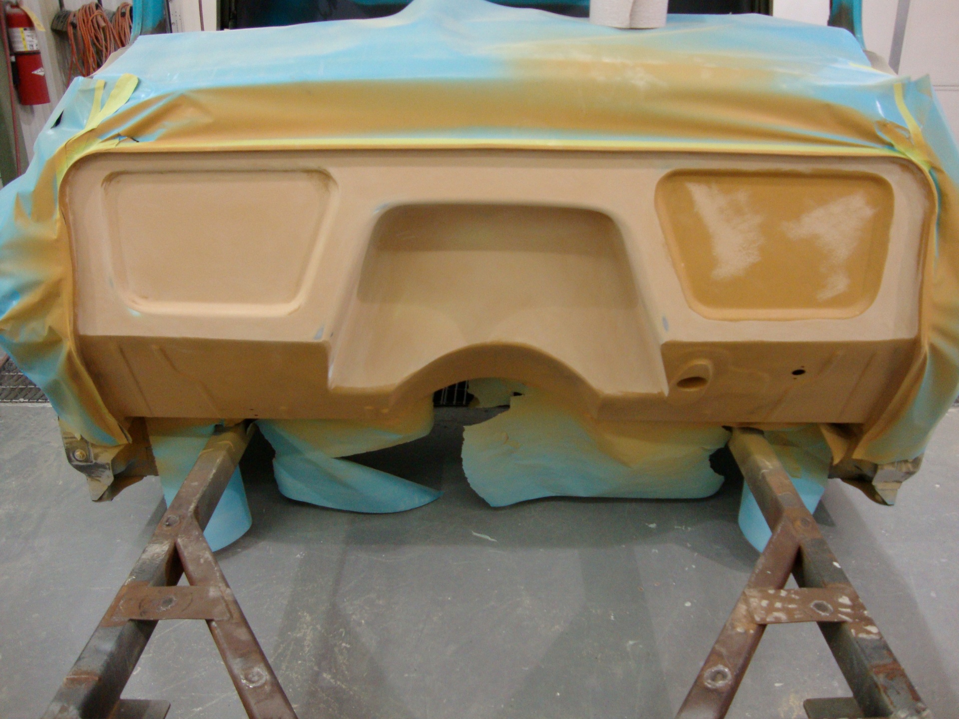 Body-worked and coated in orange high-build primer.