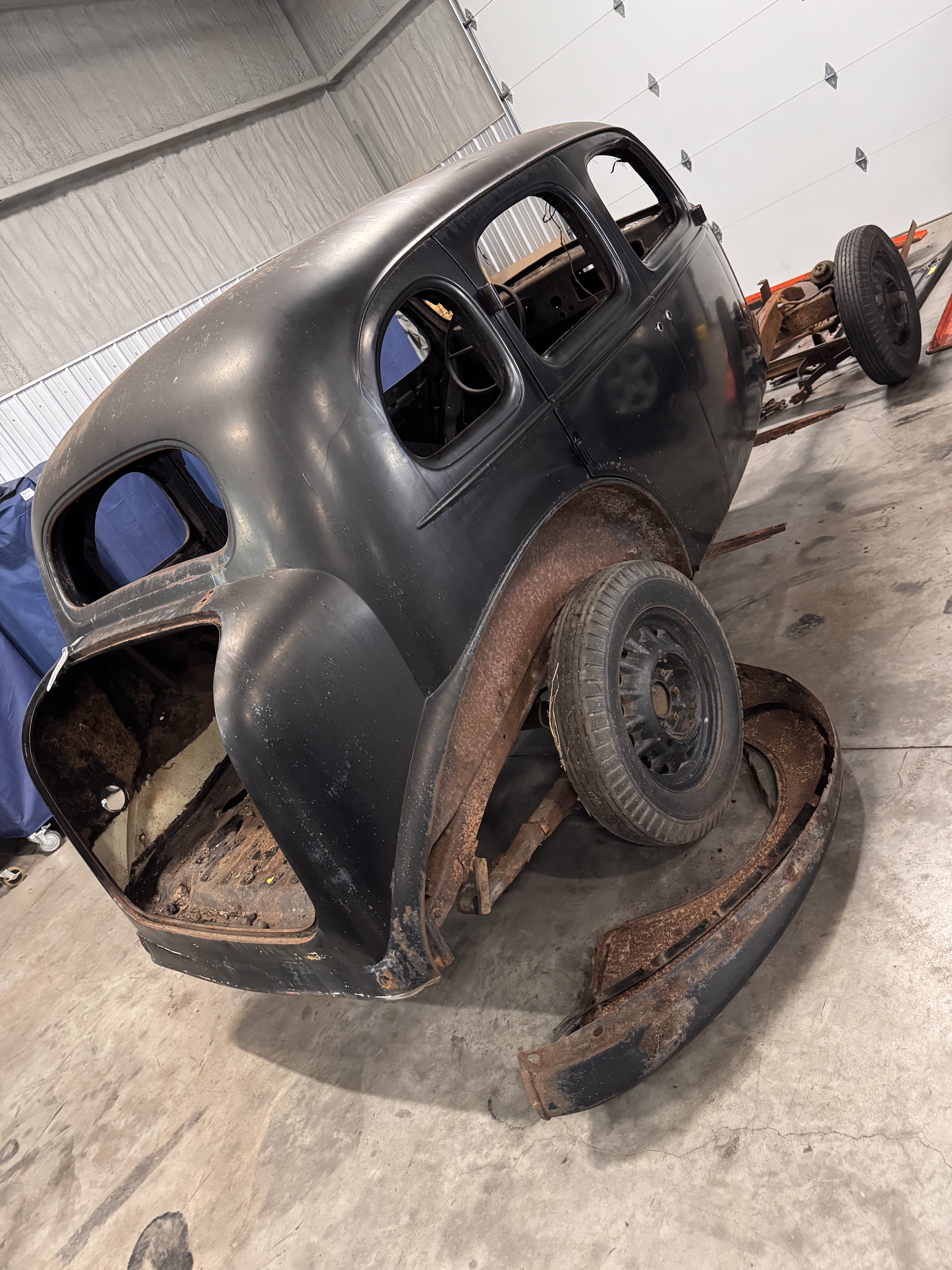 Positioned on the rotisserie for sand blasting prep.