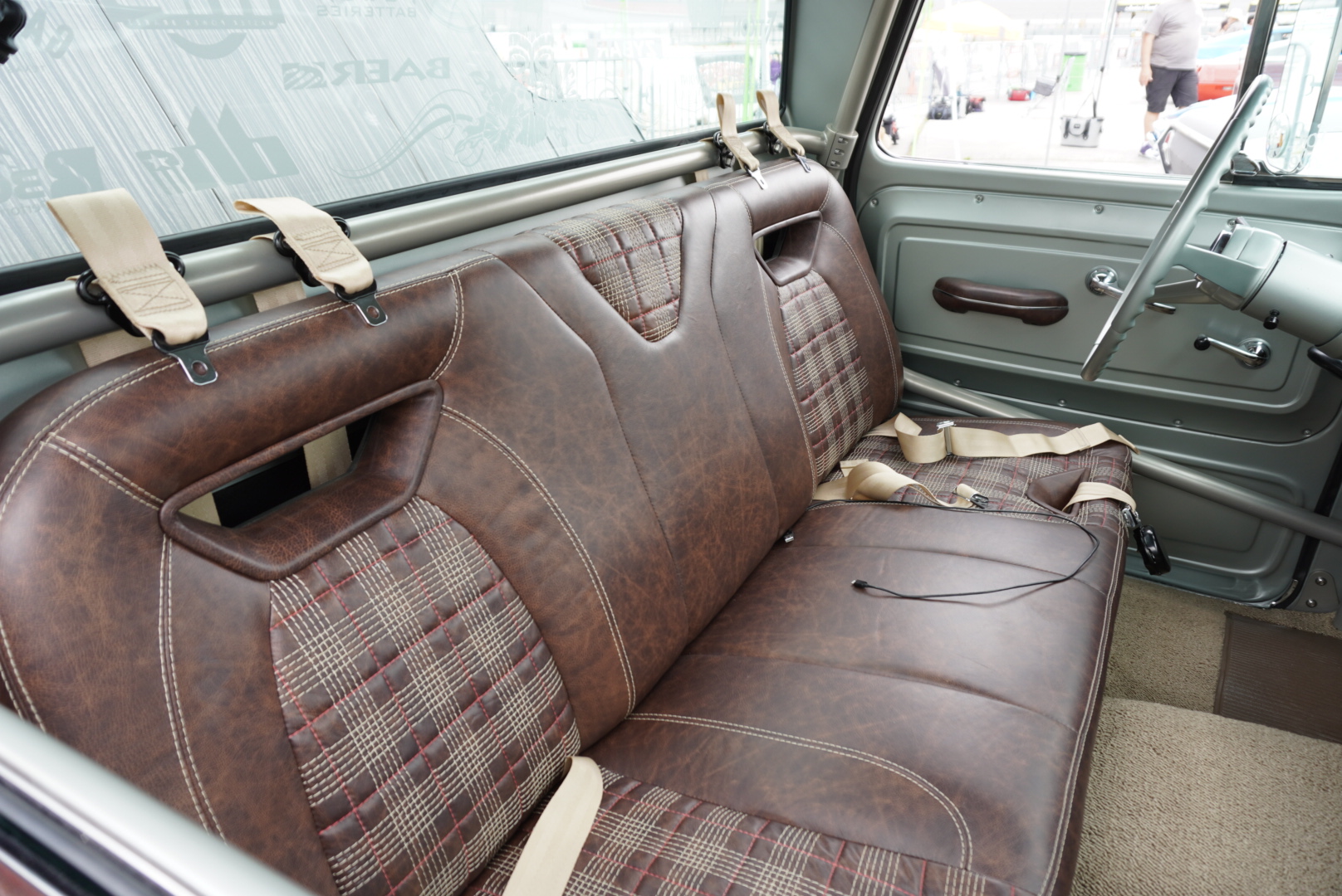 Bench seat detail — 3D-printed window inserts wrapped in Relicate distressed leather.