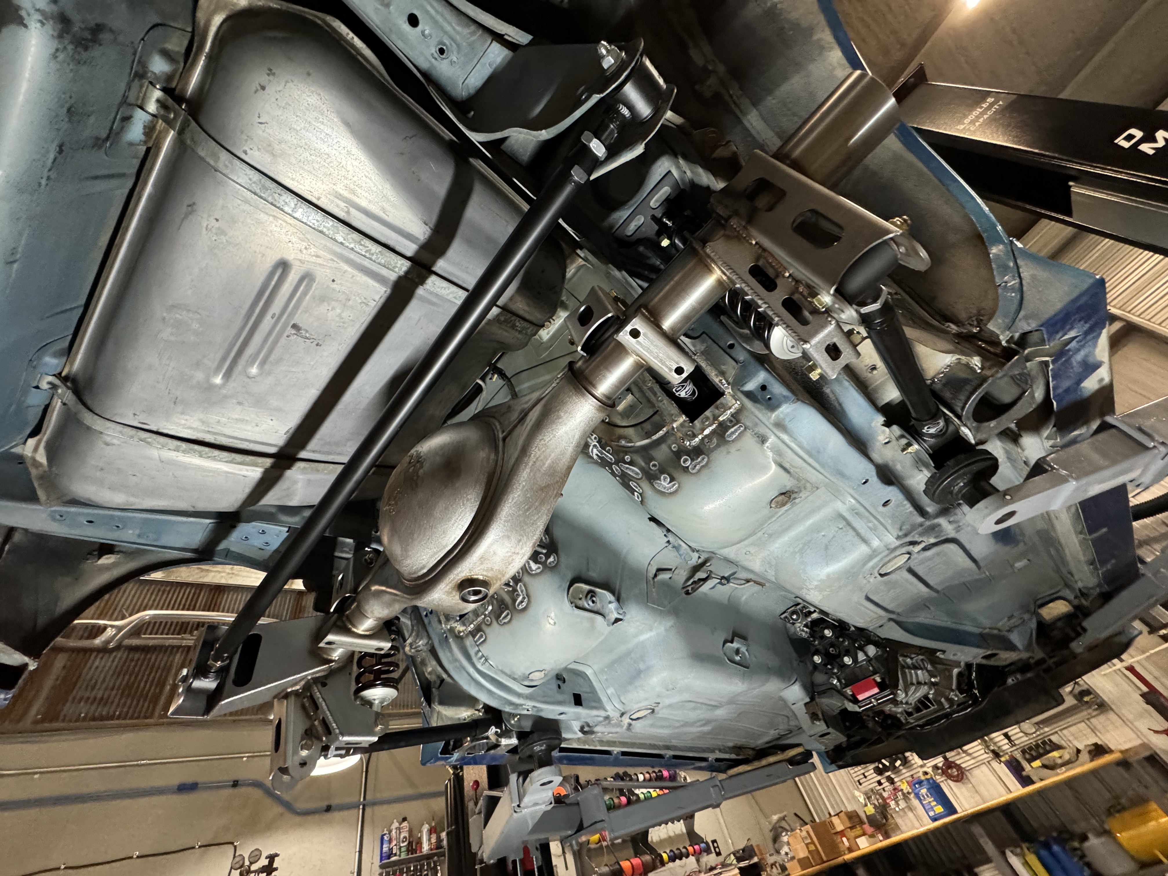 Early fabrication of the one-off transverse mono muffler and tailpipe routing.