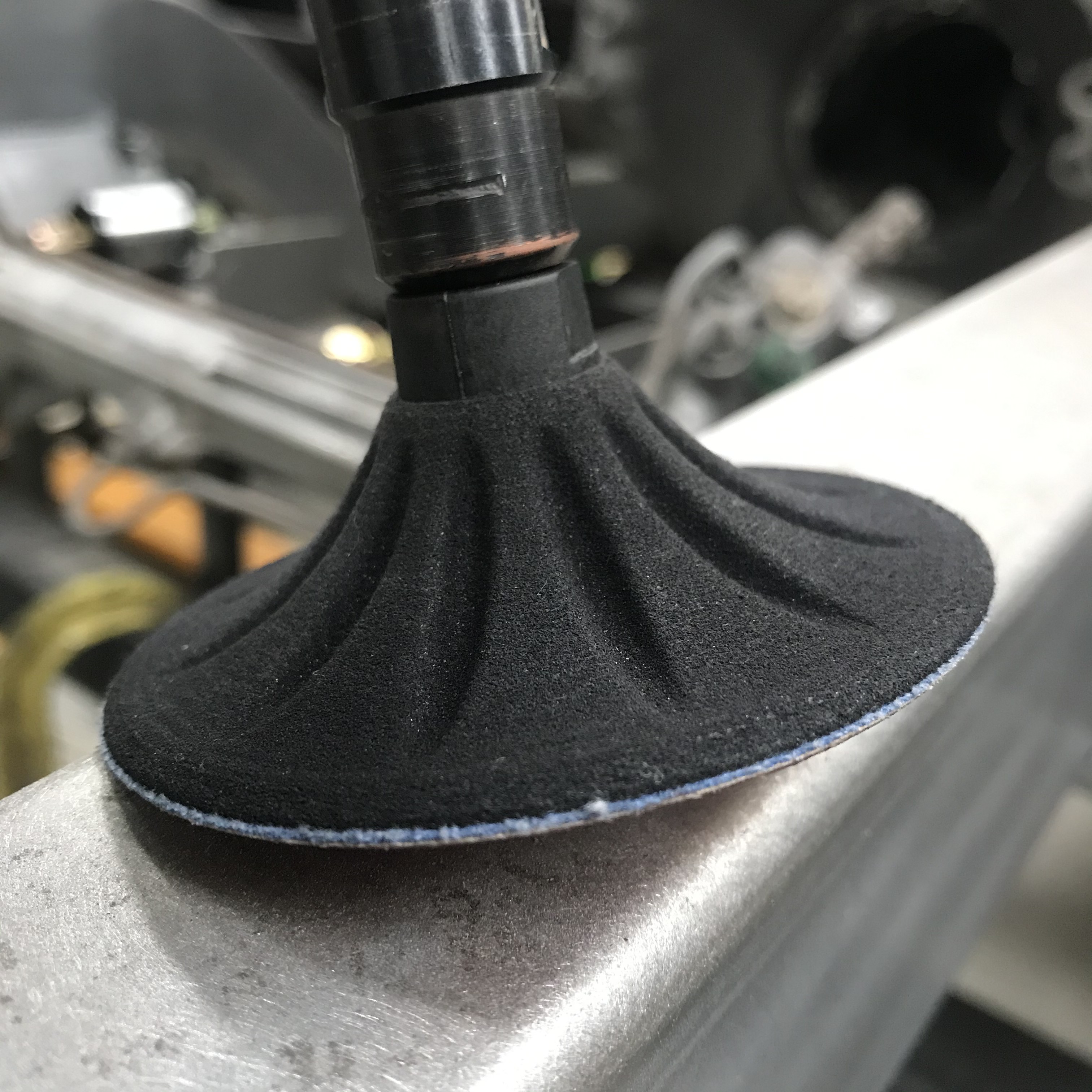 Shrinking disc working a metal-finished panel