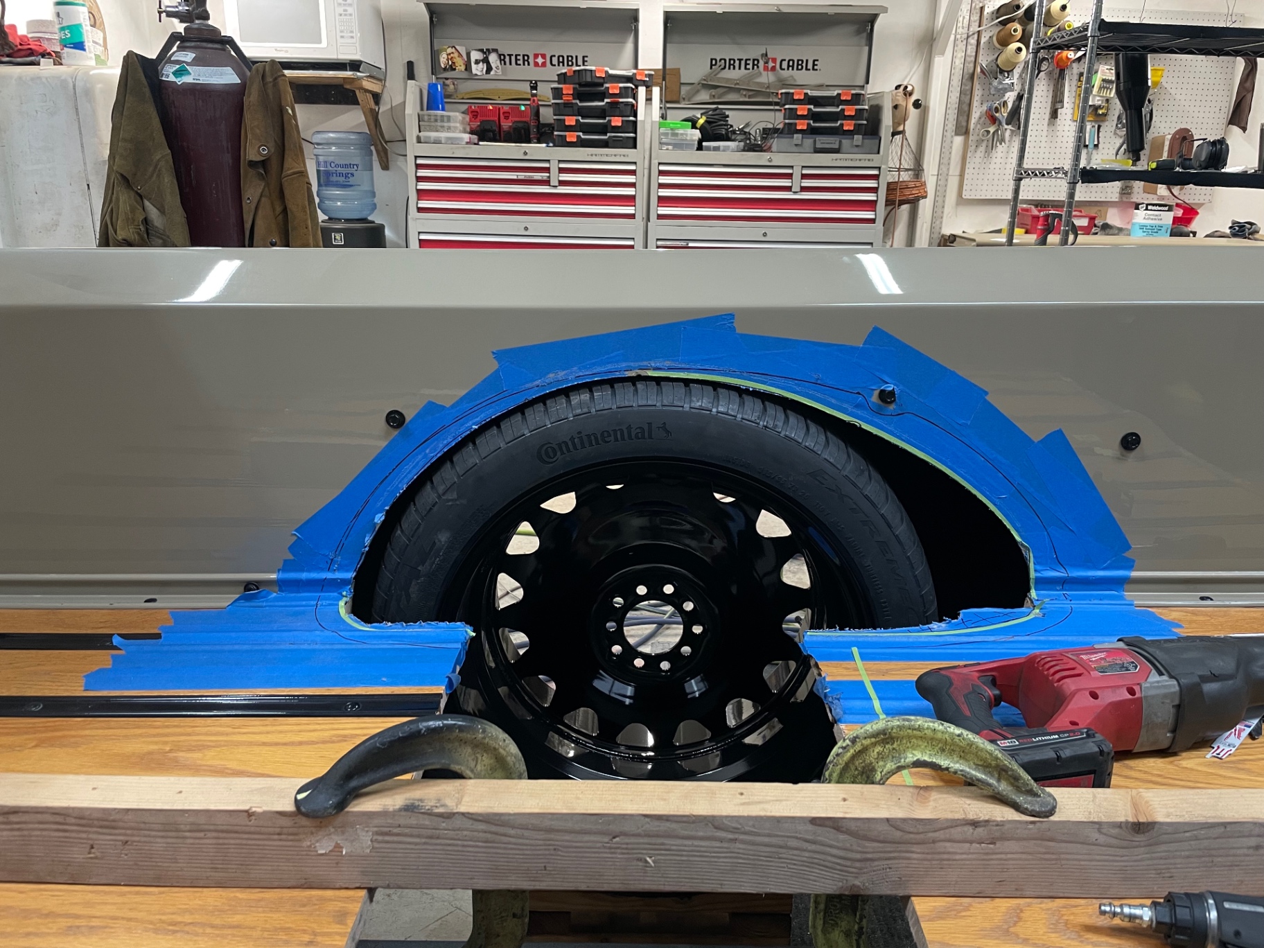 Wheel and tire clearance check through the finished tub opening.
