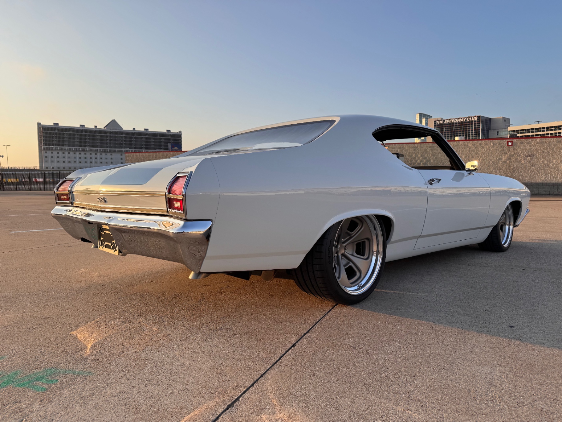 Speedway sunset — passenger rear three-quarter.