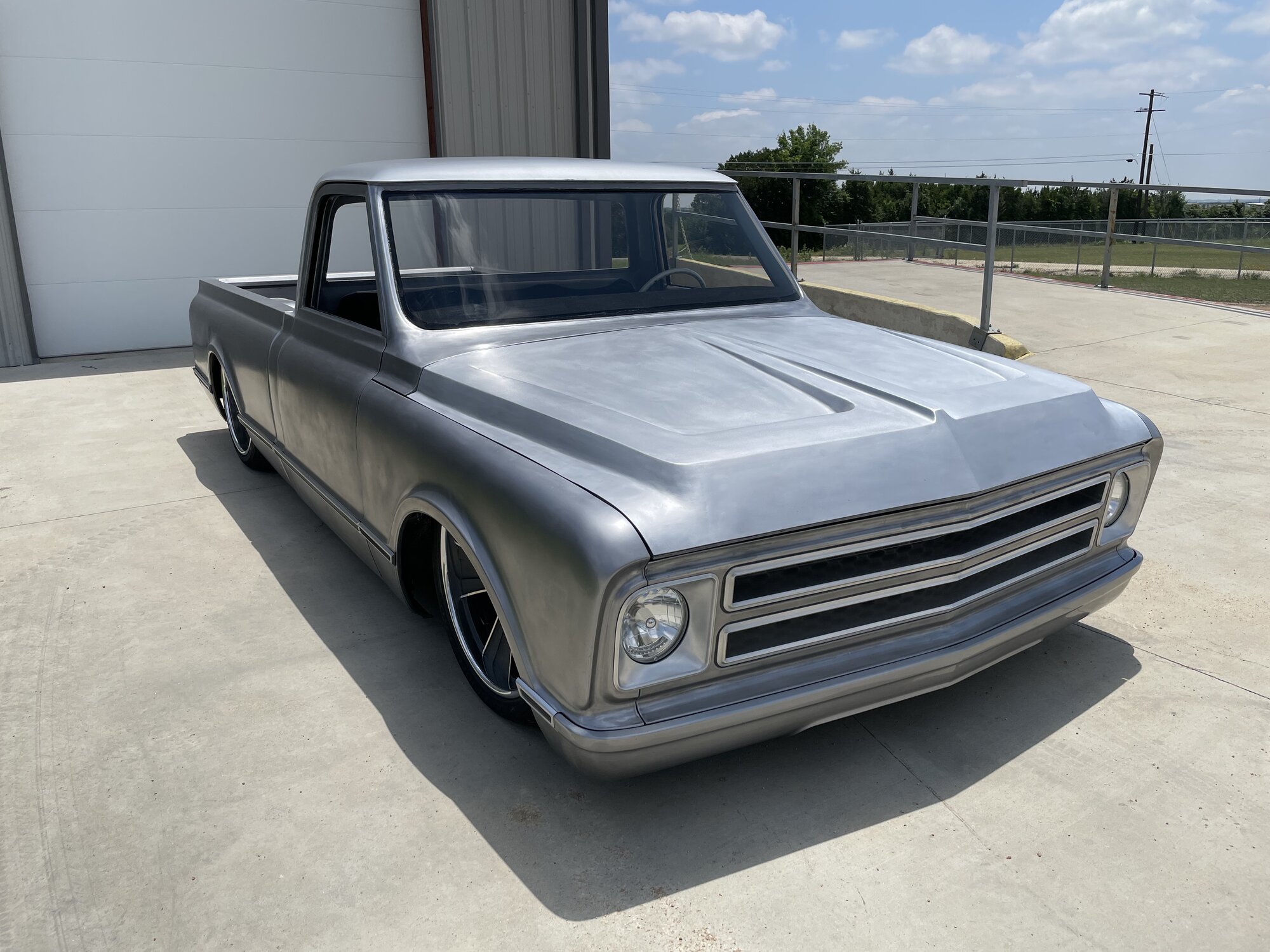 Front three-quarter. Hand-built hood, one-off grille and bezels.