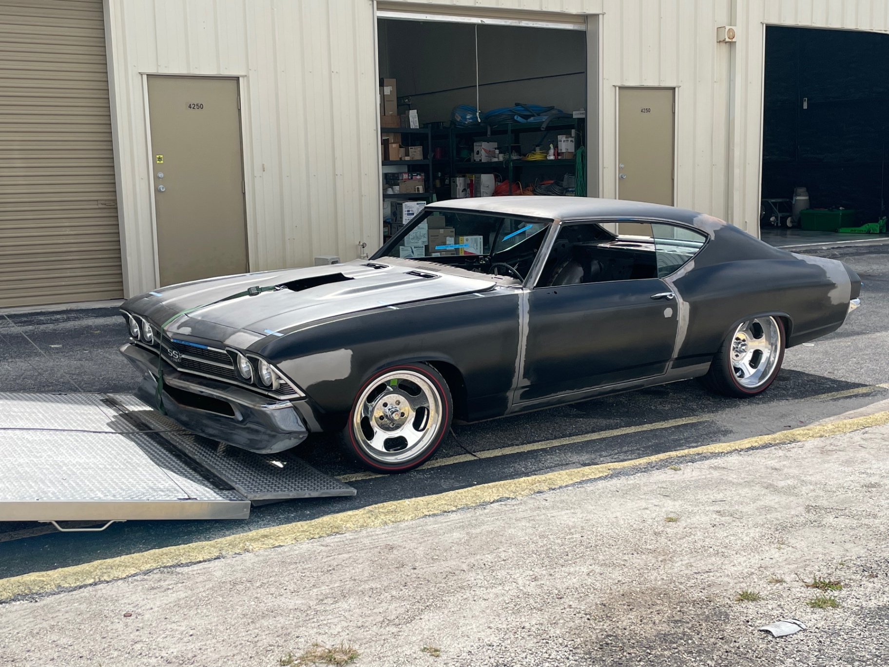 Rolling off the trailer at Hammer Fab — Florida pickup delivered.