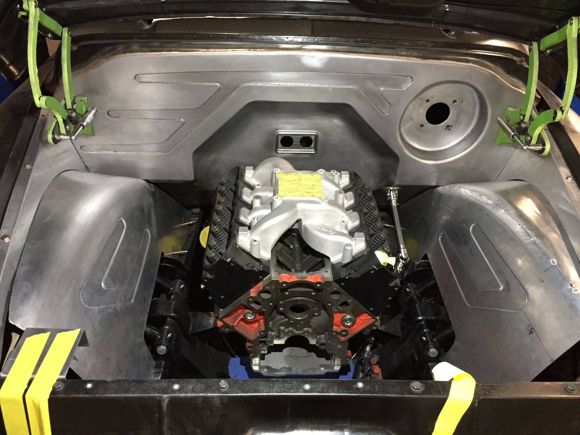 Firewall laser cut in-house design out of 10ga steel, test-fit around the LS drivetrain.