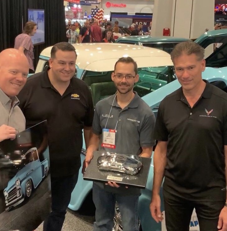 Levi accepting the 2019 Chevrolet Performance Design Award for SEMA Truck of the Year, in front of the 58 Apache in the booth.