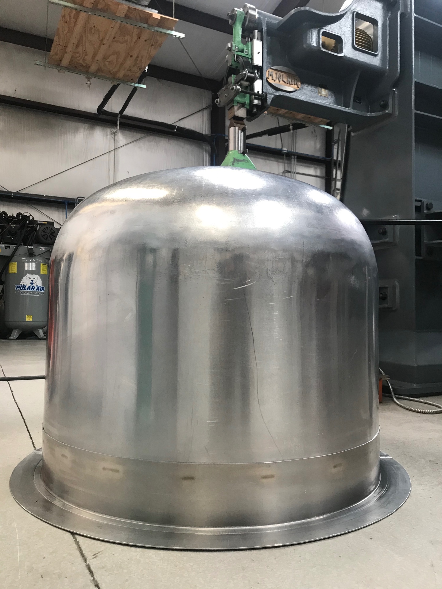 Finished dome hanging in the shop after final planishing.