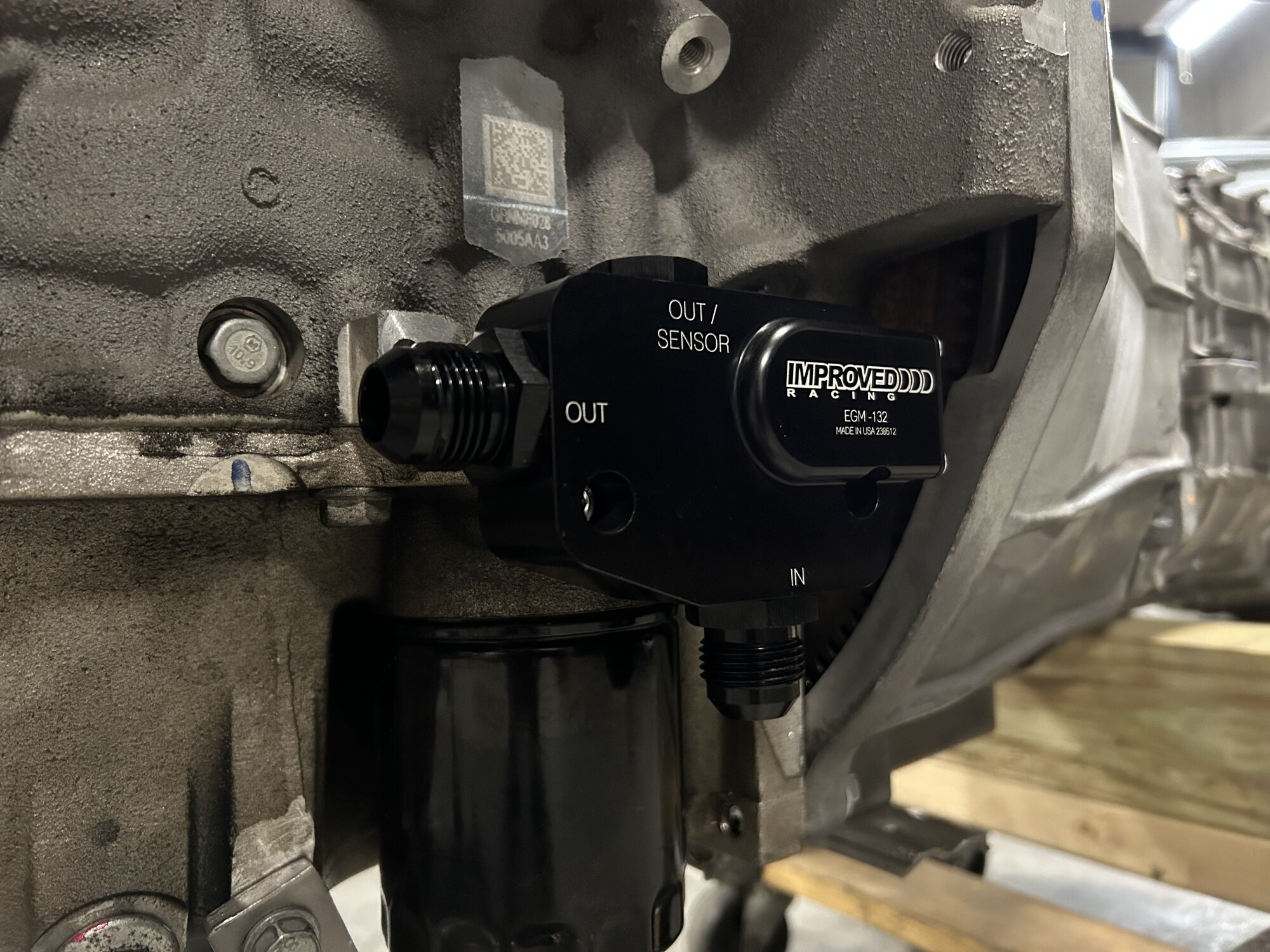 Improved Racing EGM-132 oil filter and cooler adapter with -AN fittings.