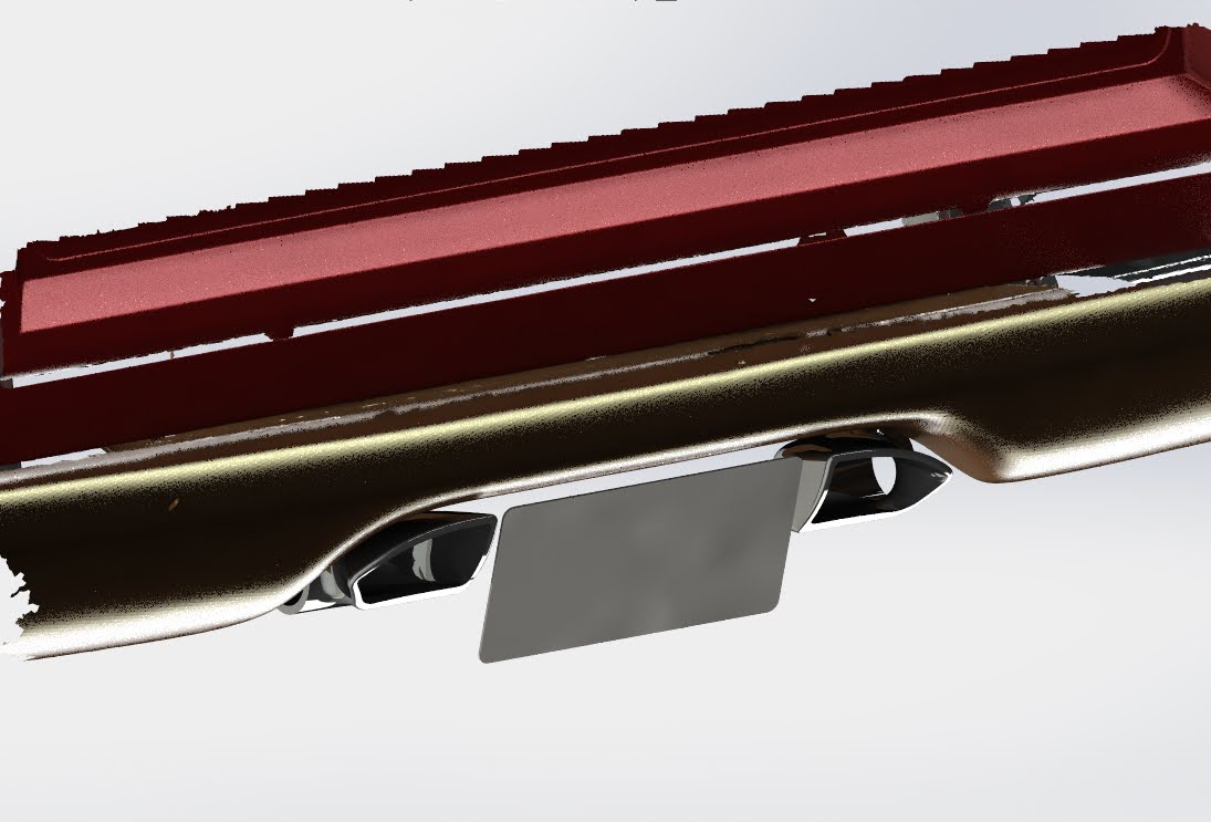CNC-machined stainless exhaust tips test-fit under the rear bumper.