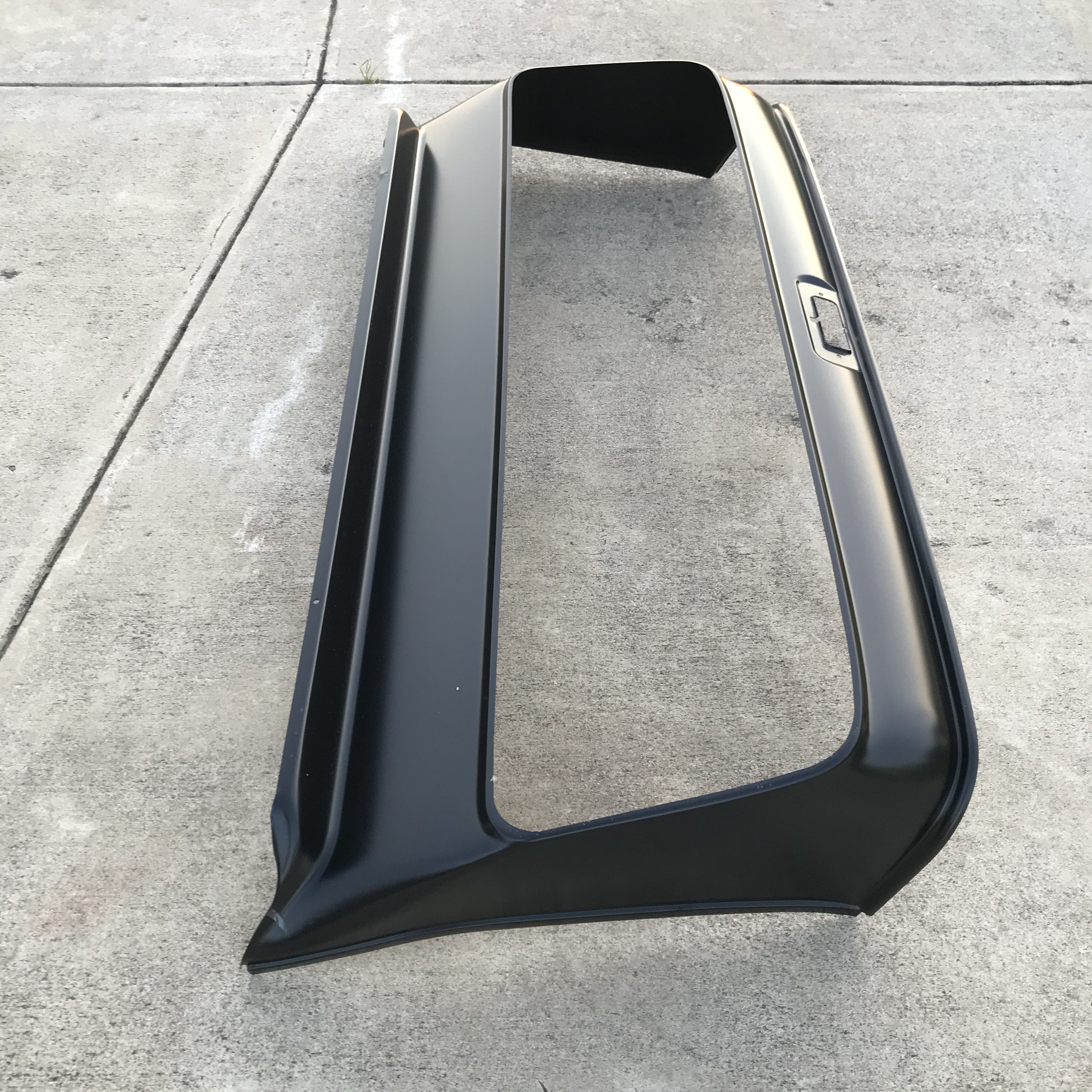 Inner cab structure refinished in the working teal shade before final assembly.
