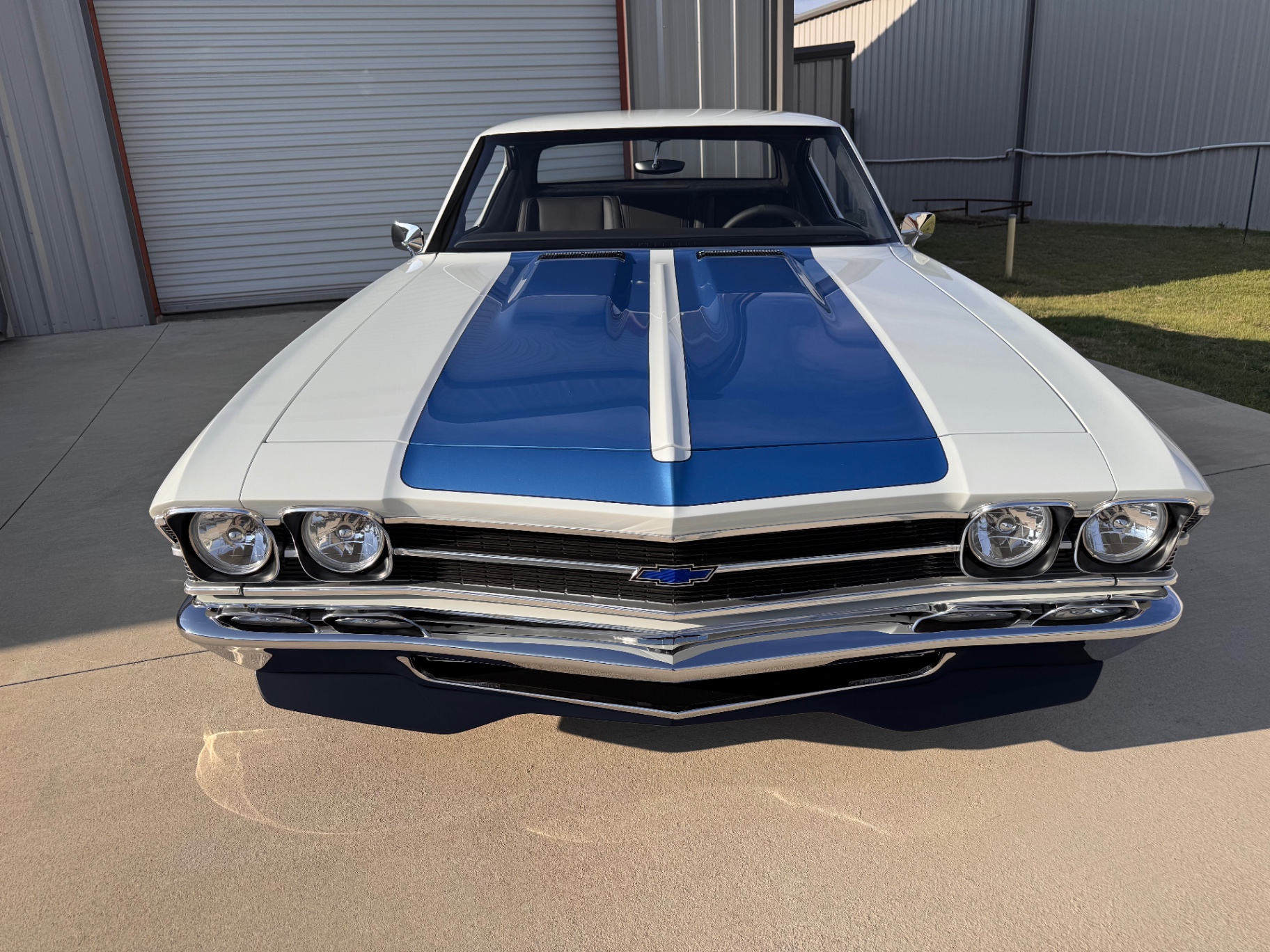 Nose-on — cowl-induction hood and blue SS stripes.
