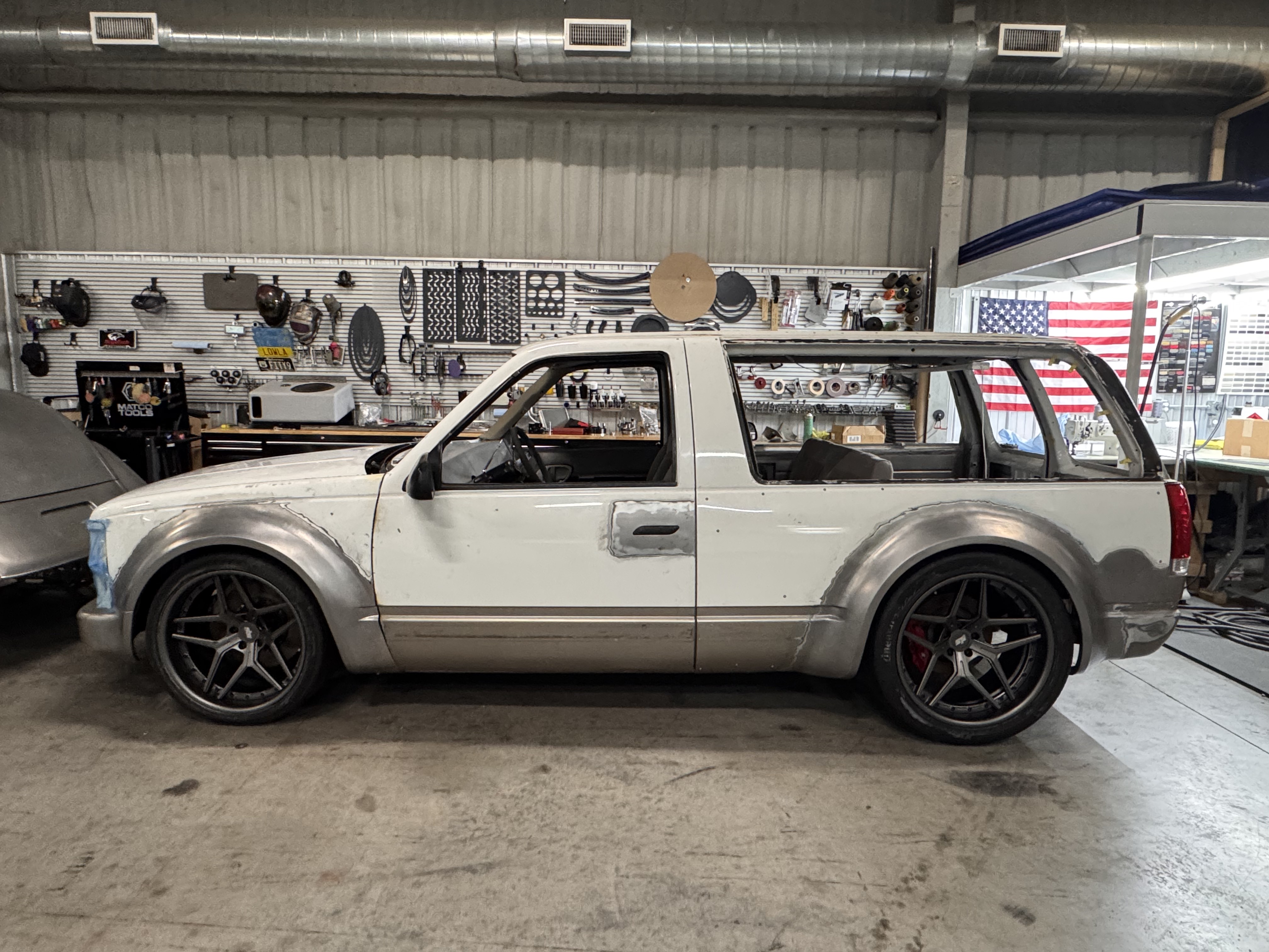Back on the floor in Bertram — full profile on the custom SP2 wheels.