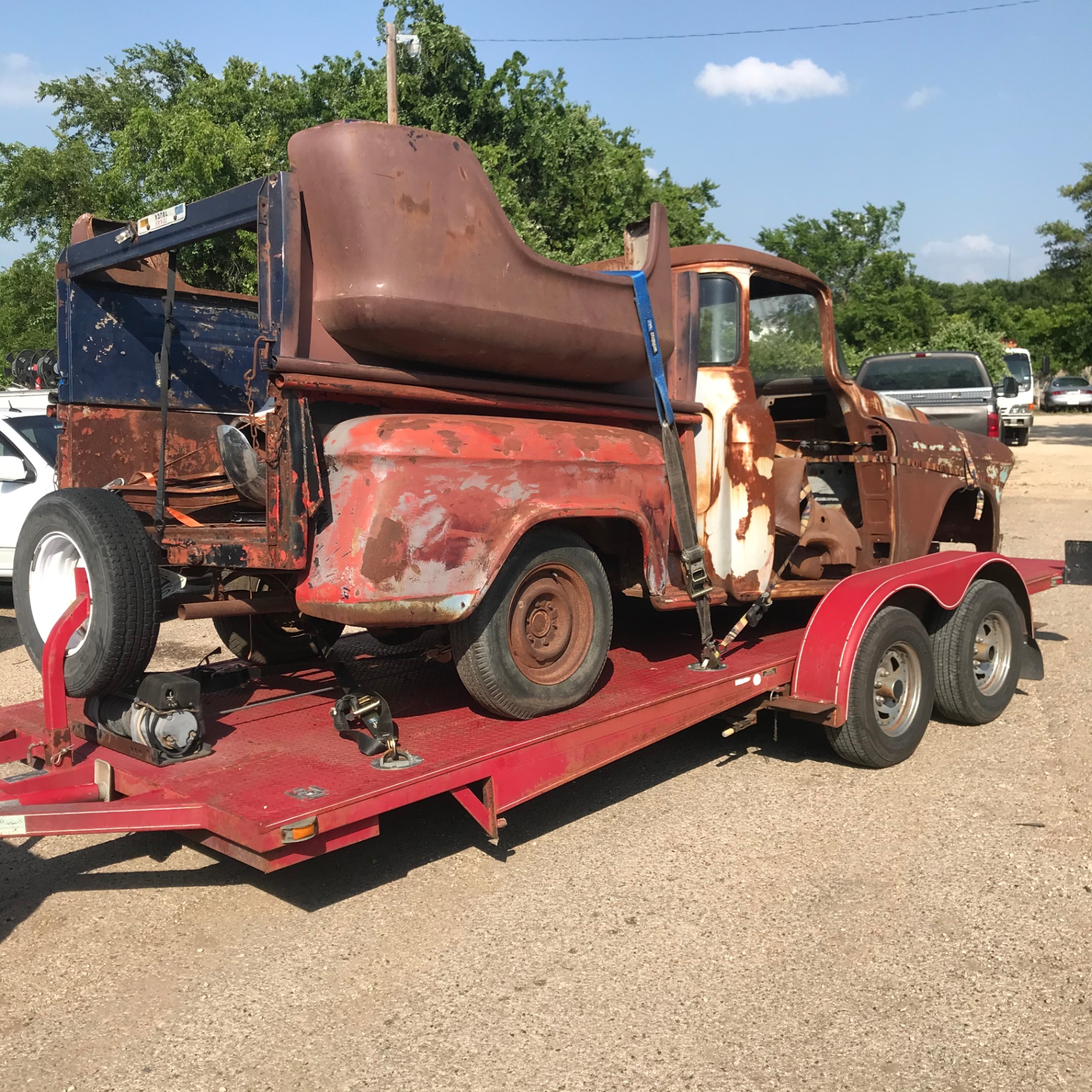 Arrival day — the 56 Chevy 3100 loaded on the trailer before teardown.