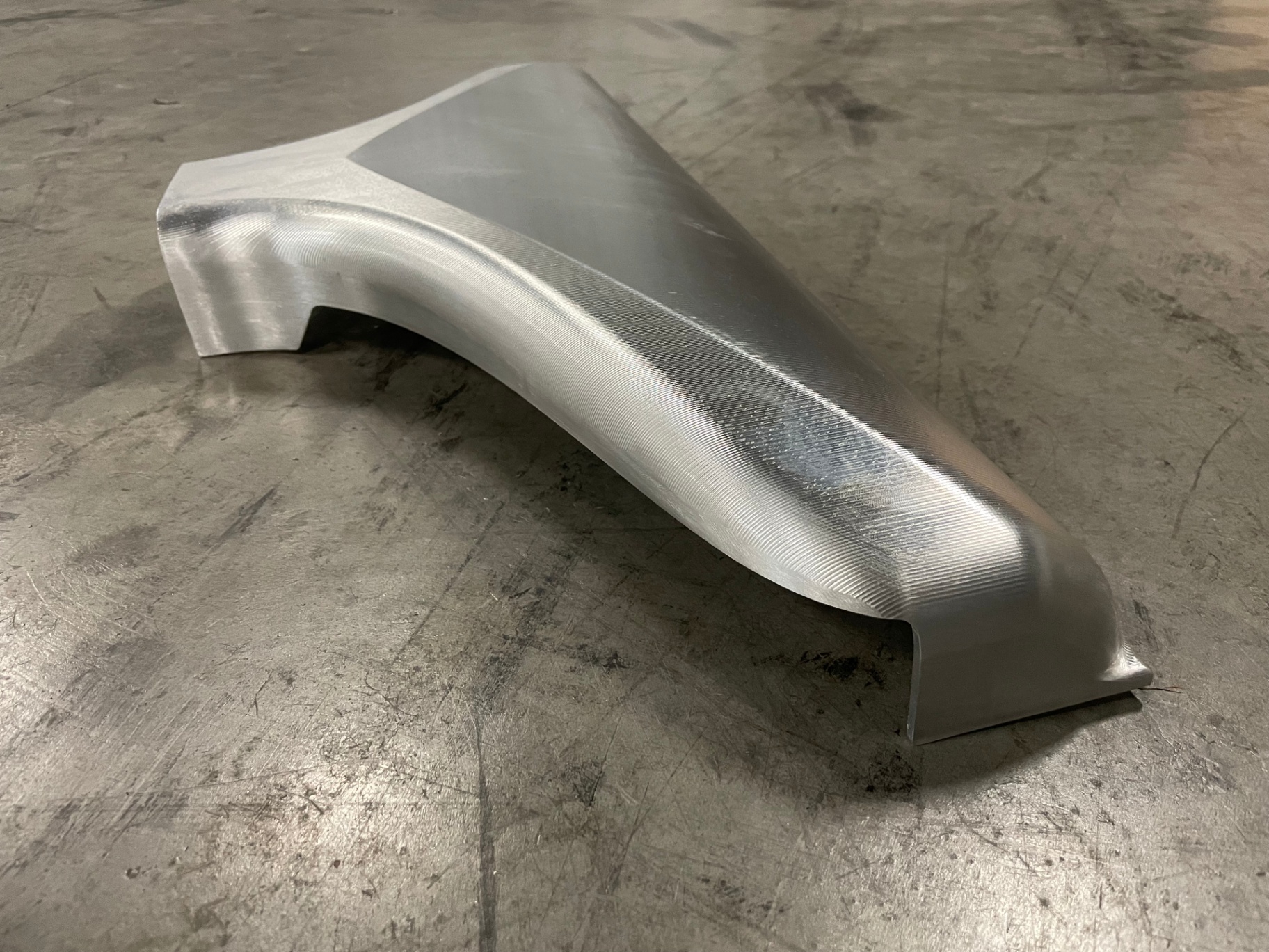 Angle view showing the sweeping transition from the intercooler face up into the plenum inlet.