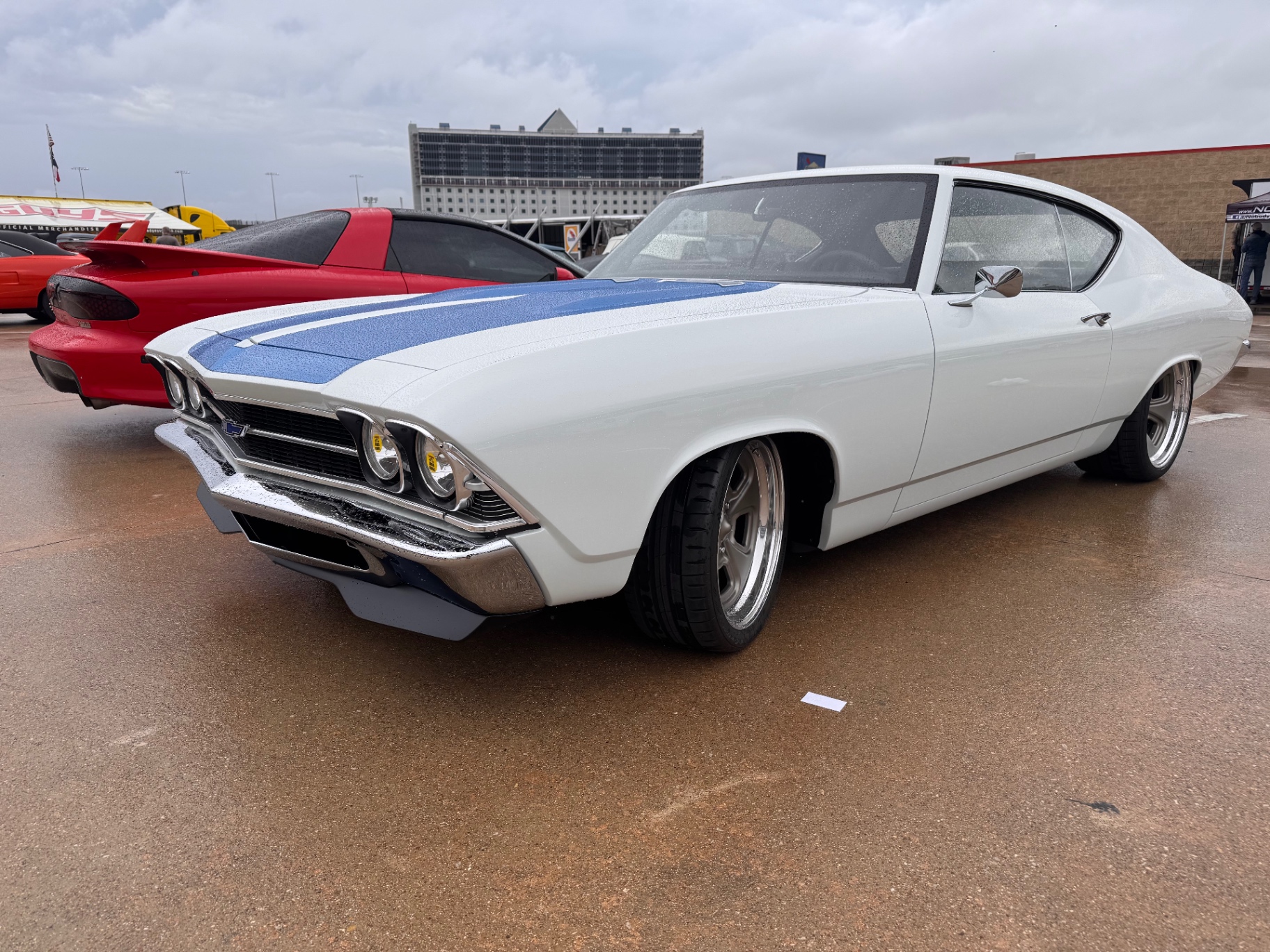 Show floor — driver-side front three-quarter in the paddock.