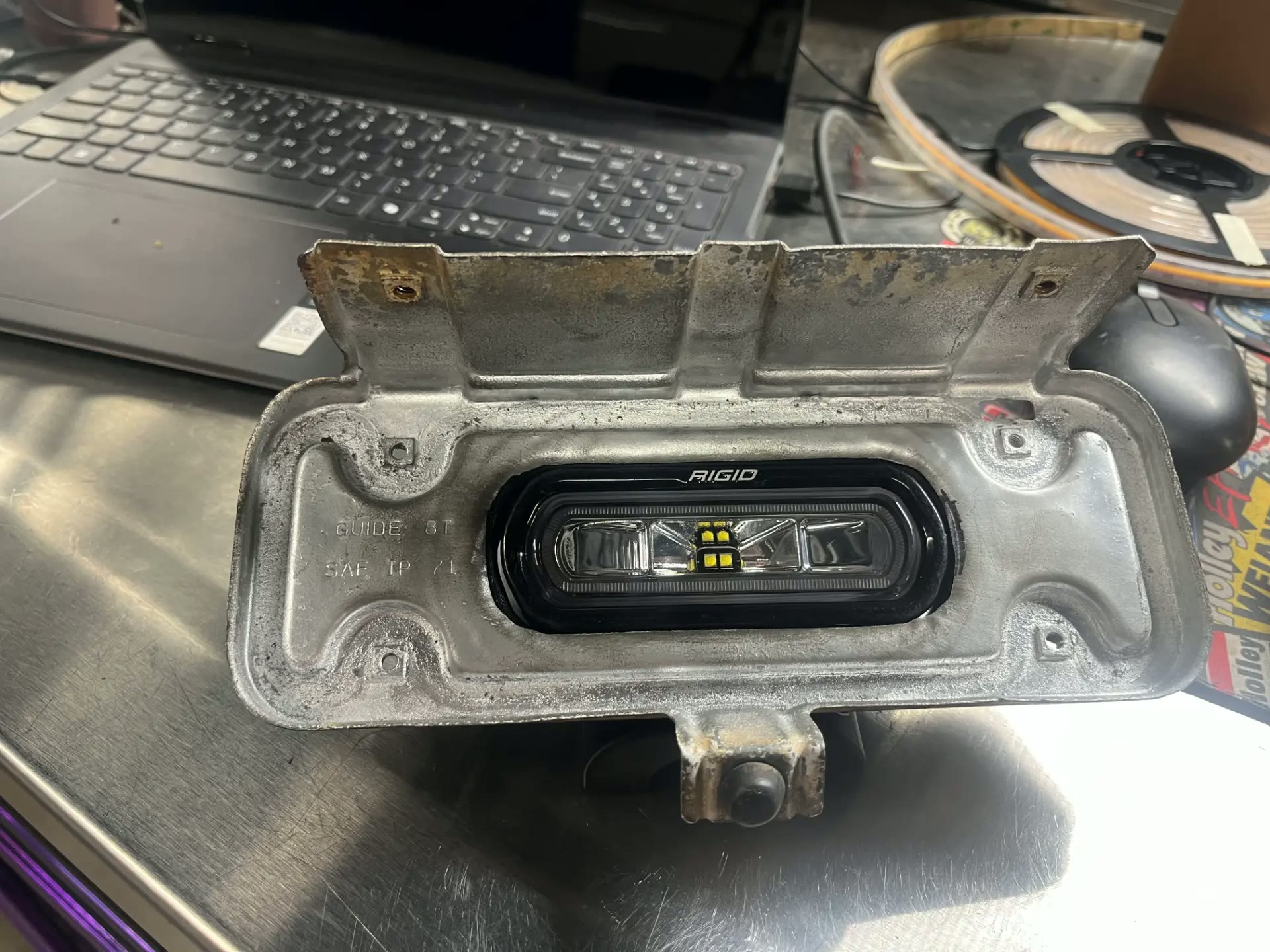 LED driving light module fitted inside the stock turn signal housing.