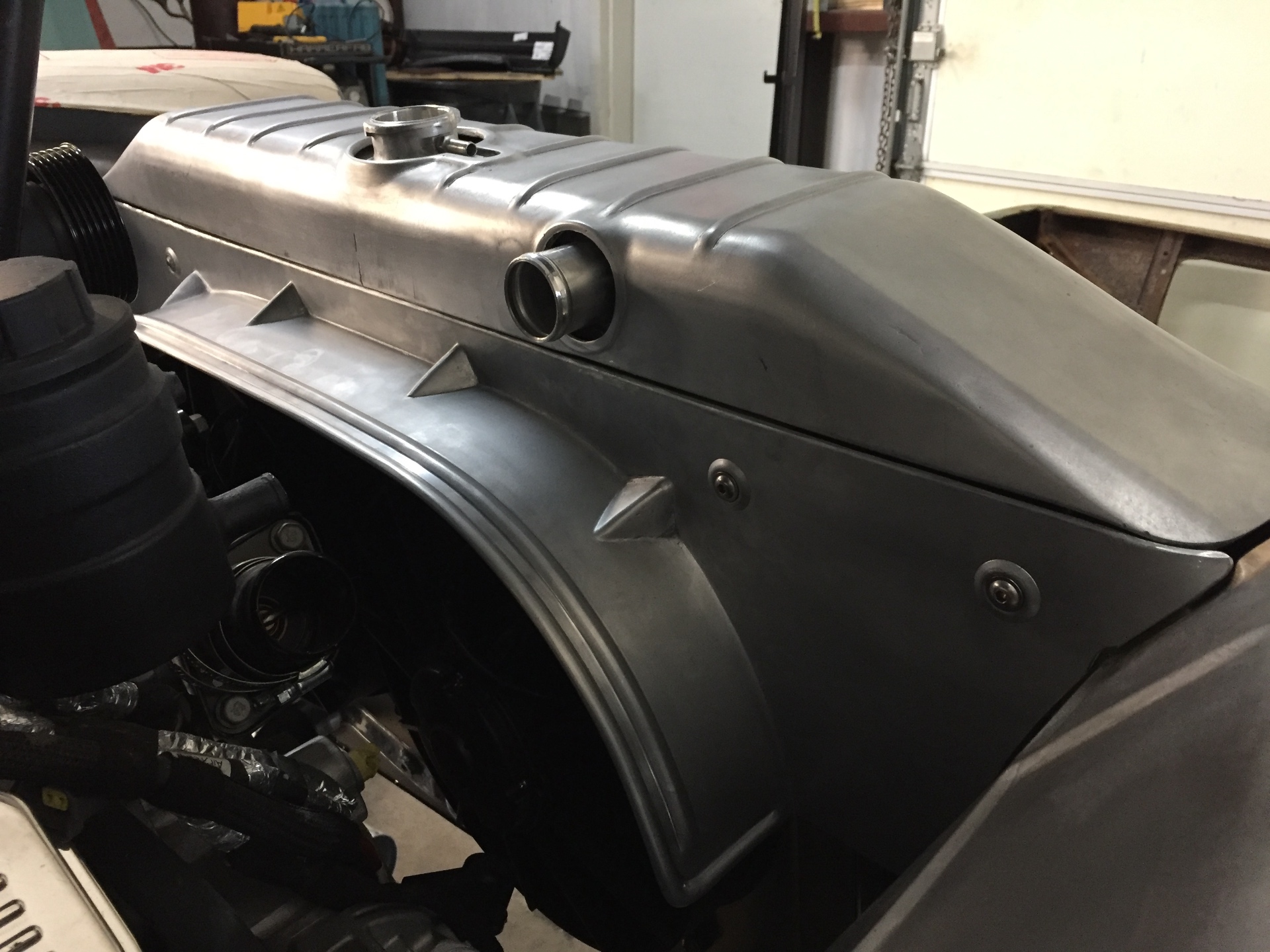 Installed in the engine bay — radiator cover and fan shroud working as one piece.