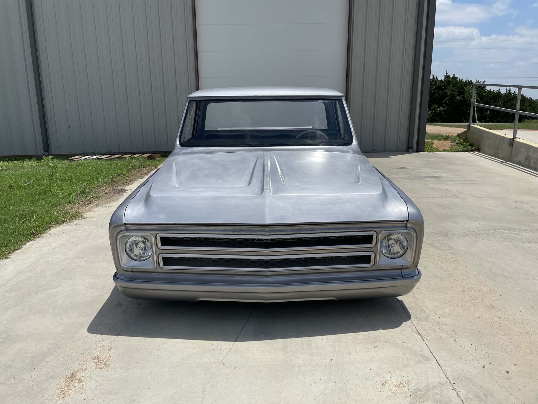 Head on. Hand-built aluminum hood and one-off grille.