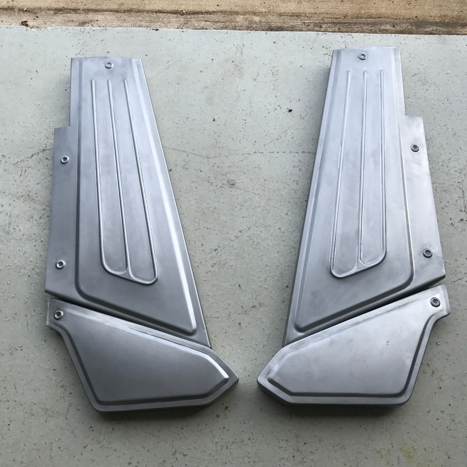Matched pair of inner panels with beadwork and dimple-died mounting points.