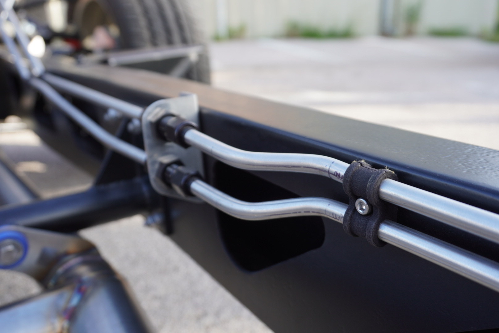 Sway bar and chassis detail under a custom build