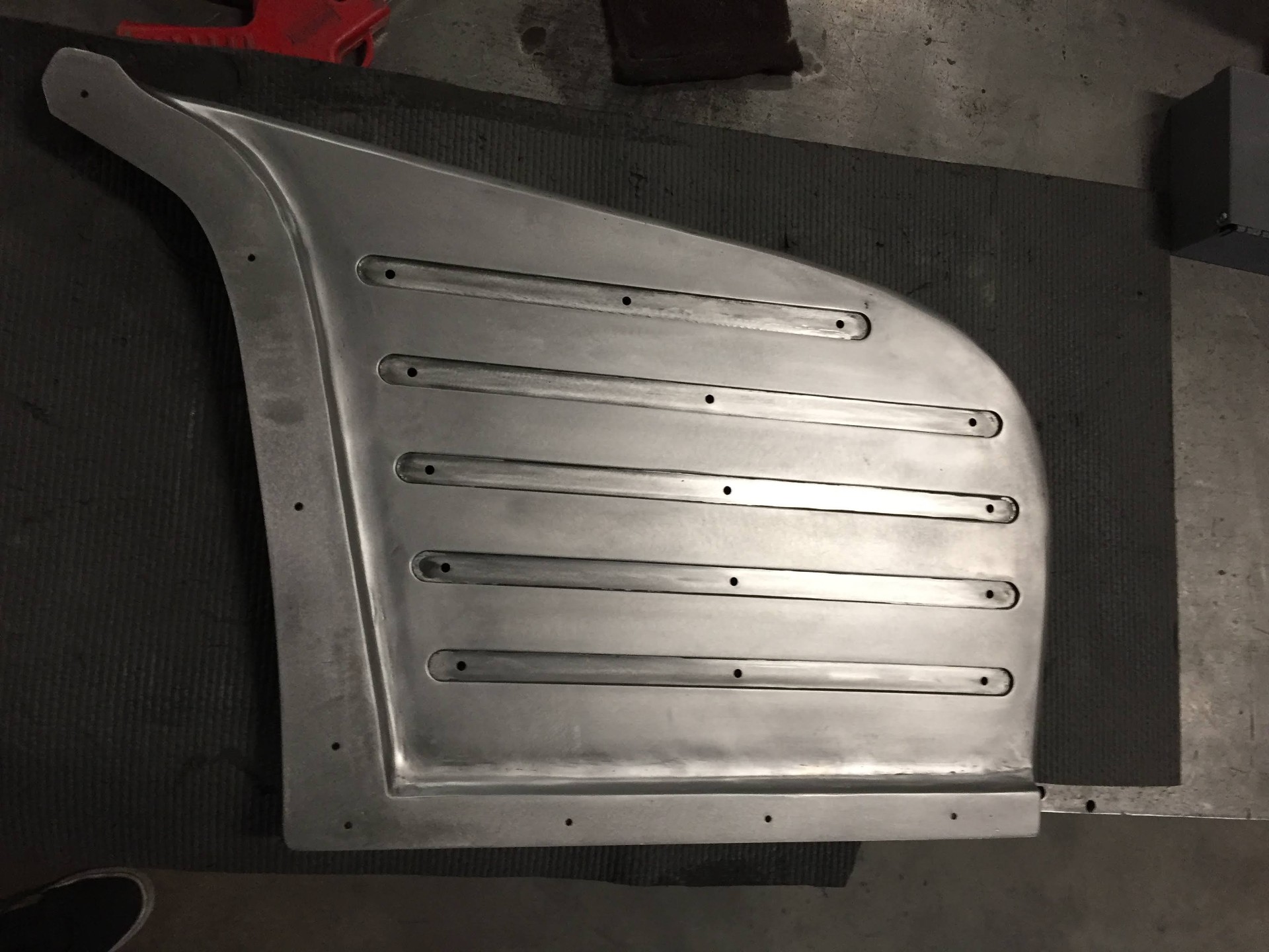 Fresh bed floor panel detail during fabrication.