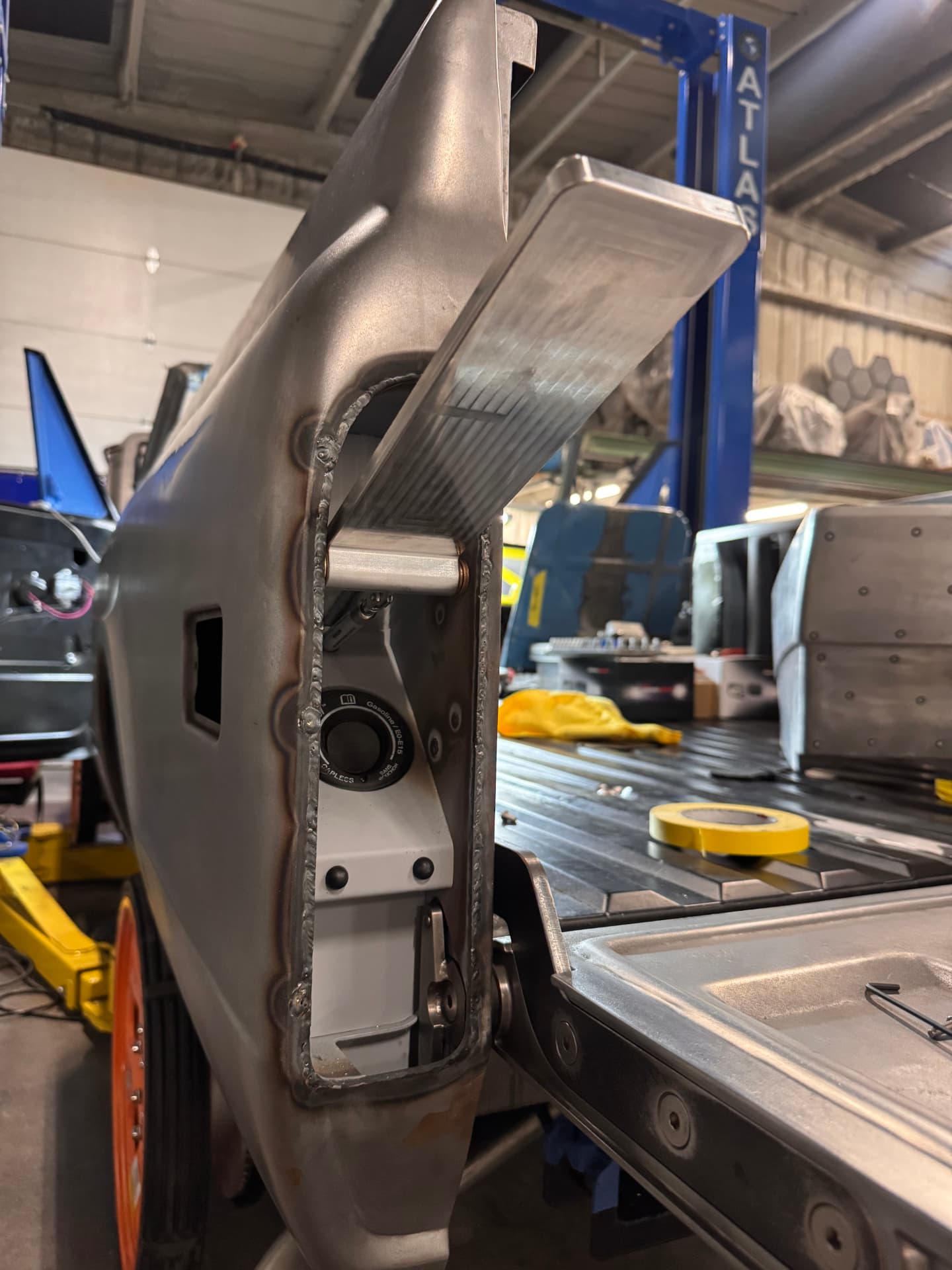 Quarter panel with the fuel filler housing welded in.