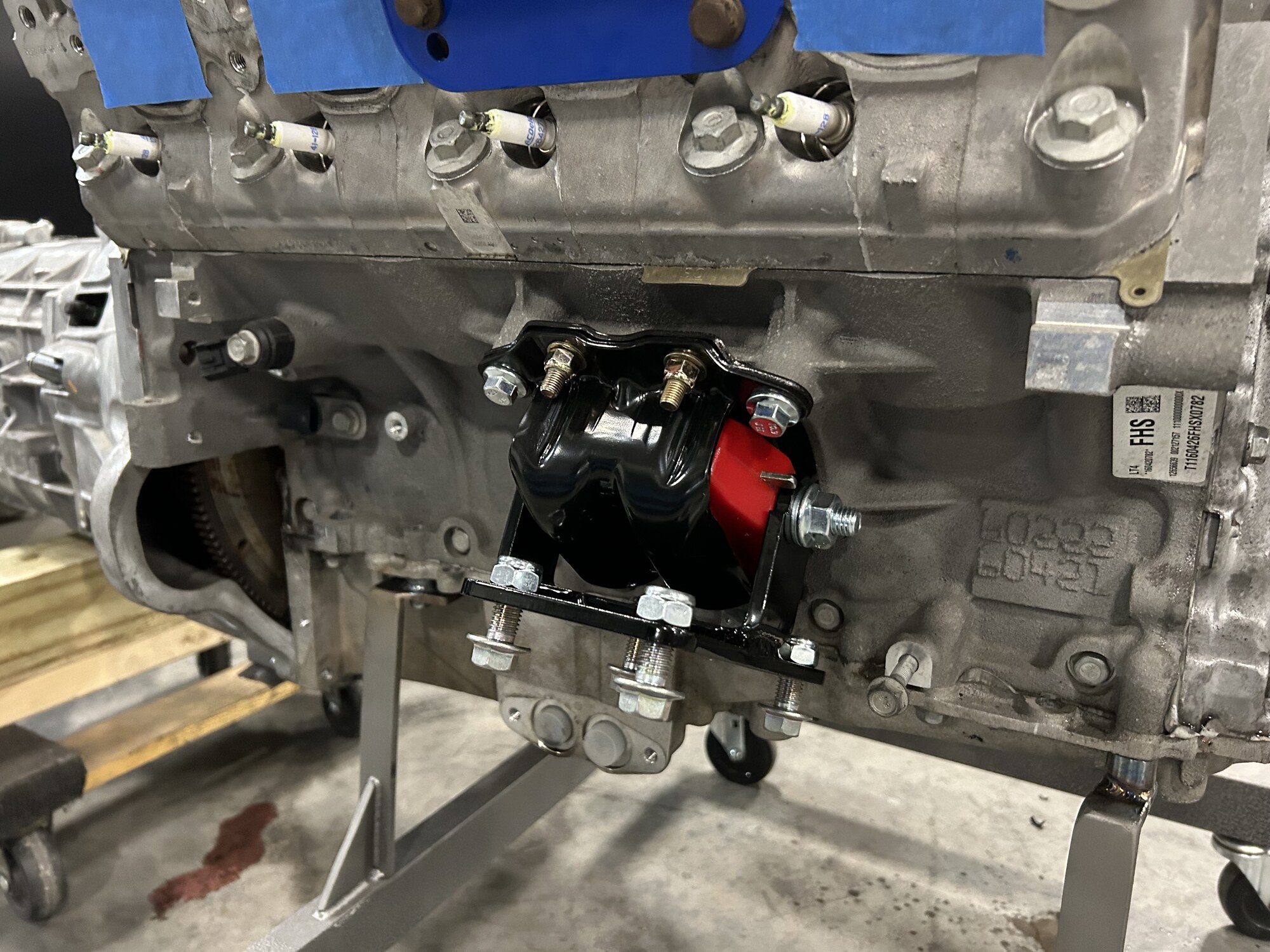 Motor mount hardware bolted to the LT4 block on the stand.