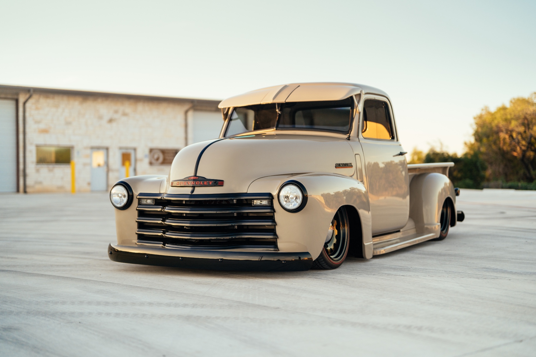 Sunset front three-quarter — warm light pulling the tan warmer.