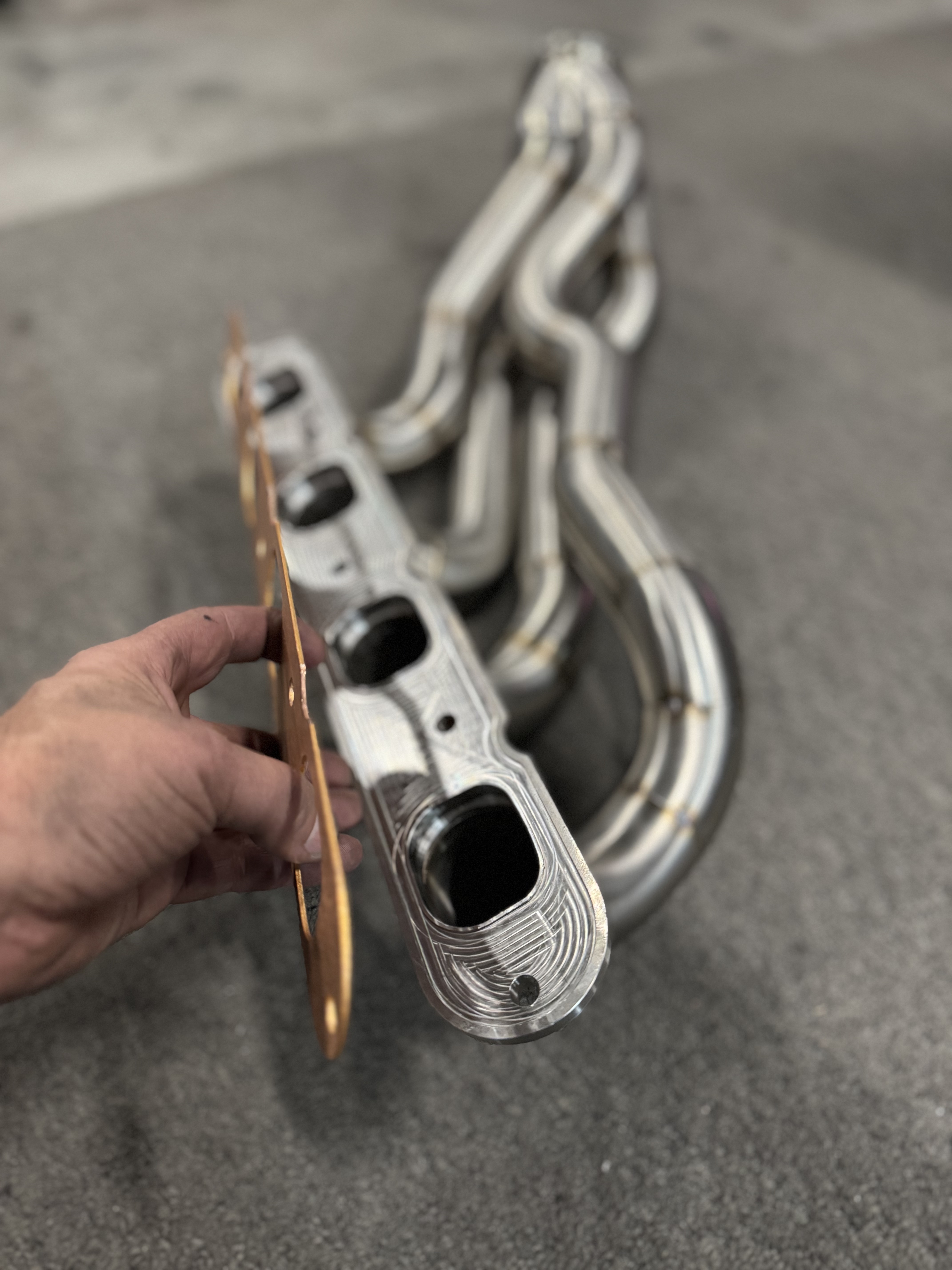 Machining detail on the flange face — port shapes and sealing surface.