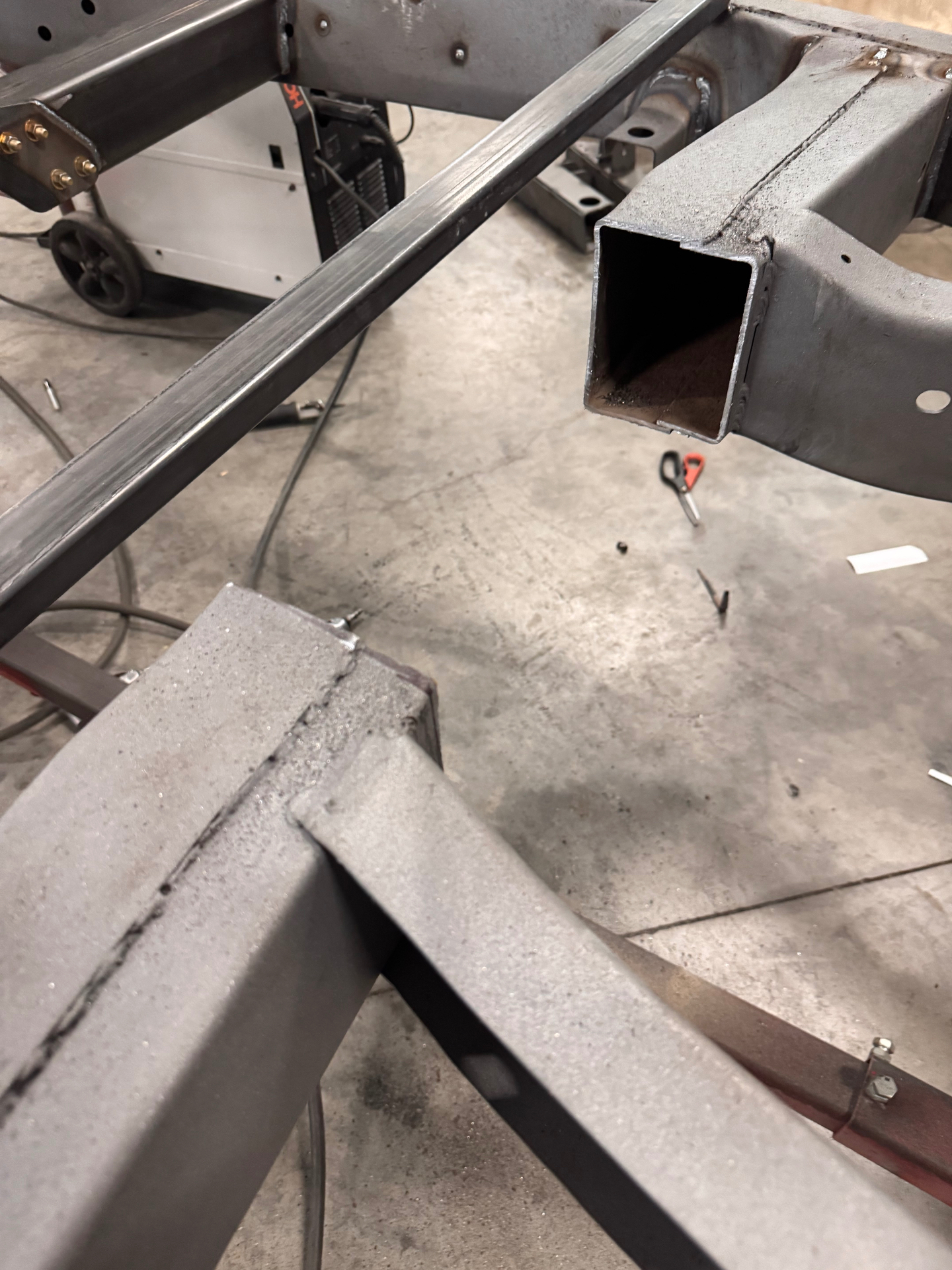 Old torque tube joint cut out and replaced with a welded-in arch; the drop-out section lets the transmission and exhaust drop for service
