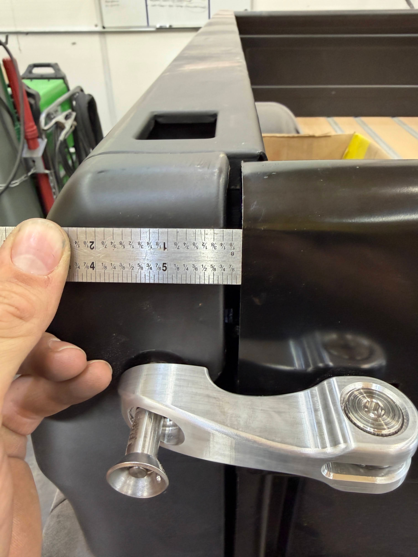 Measuring the latch arm geometry against the bedside before final fit.