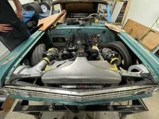 Grille-level view — the plumbing package inside the front clip is taking shape.