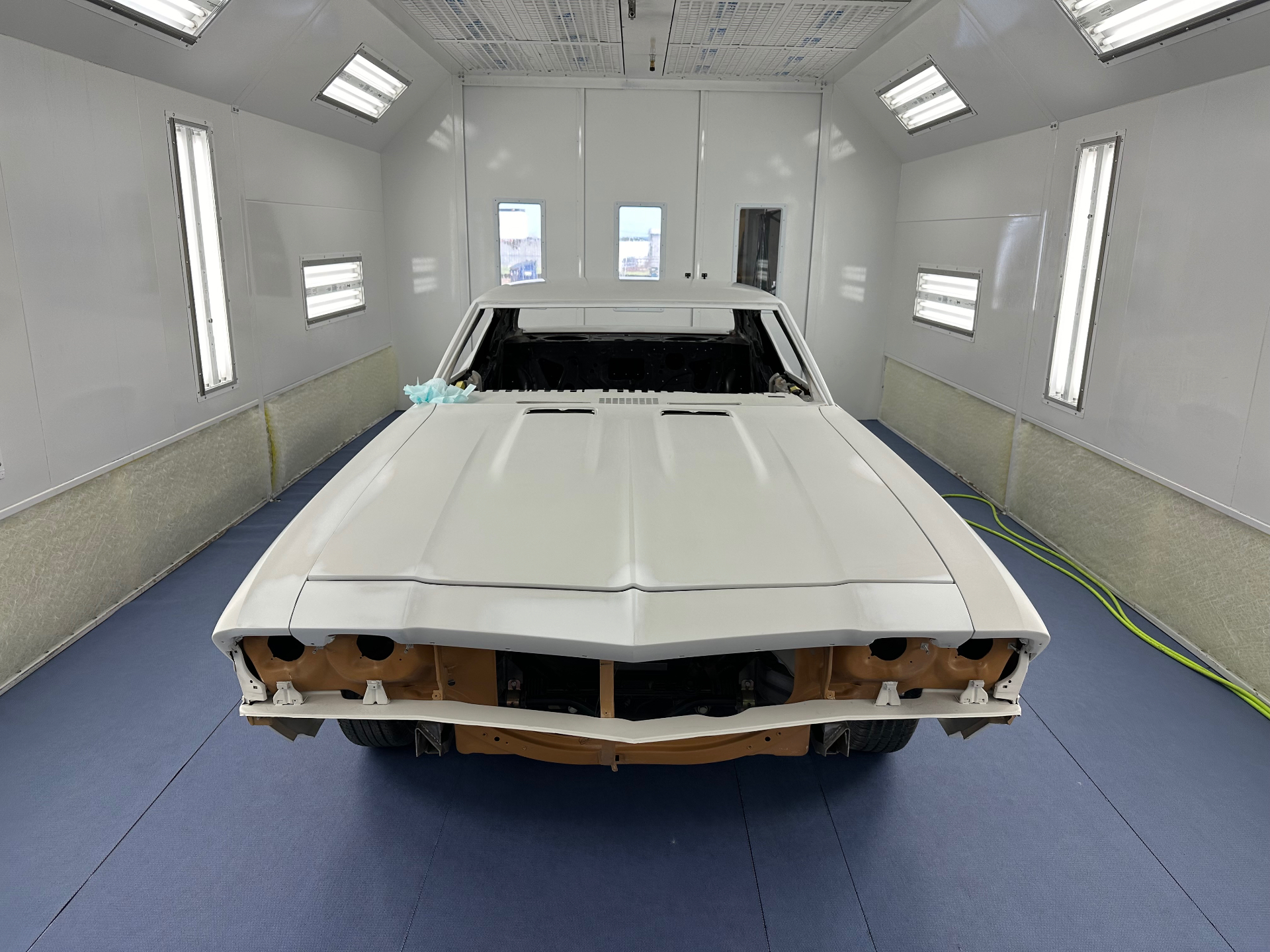 Front clip in sealer inside the downdraft booth — ready for base.
