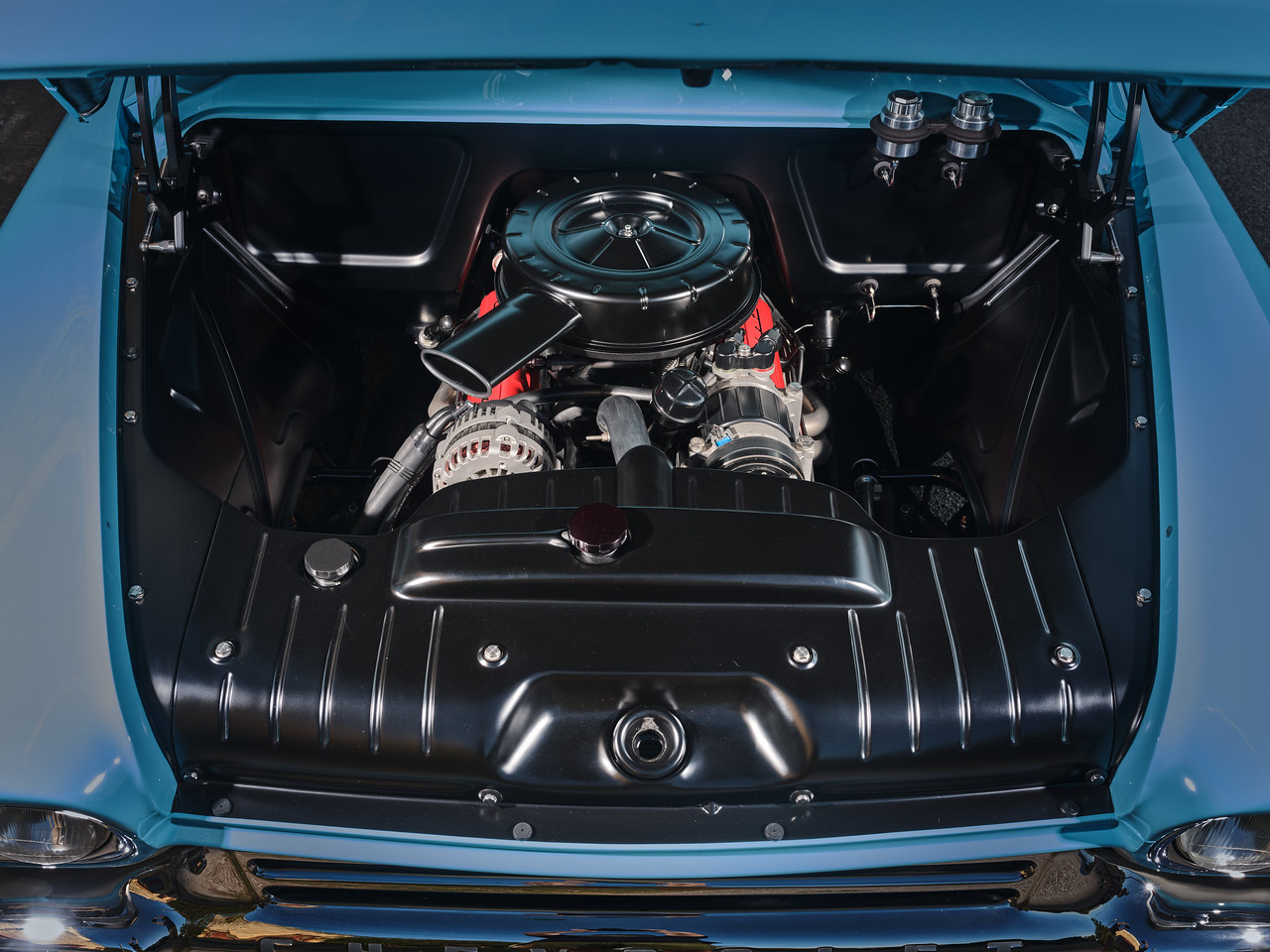 Engine bay — 355 CI small block from a '75 Caprice (built by a family mechanic friend and still running strong), backed by a Turbo 350 and an IROC Camaro rear diff, with GM brakes all around.