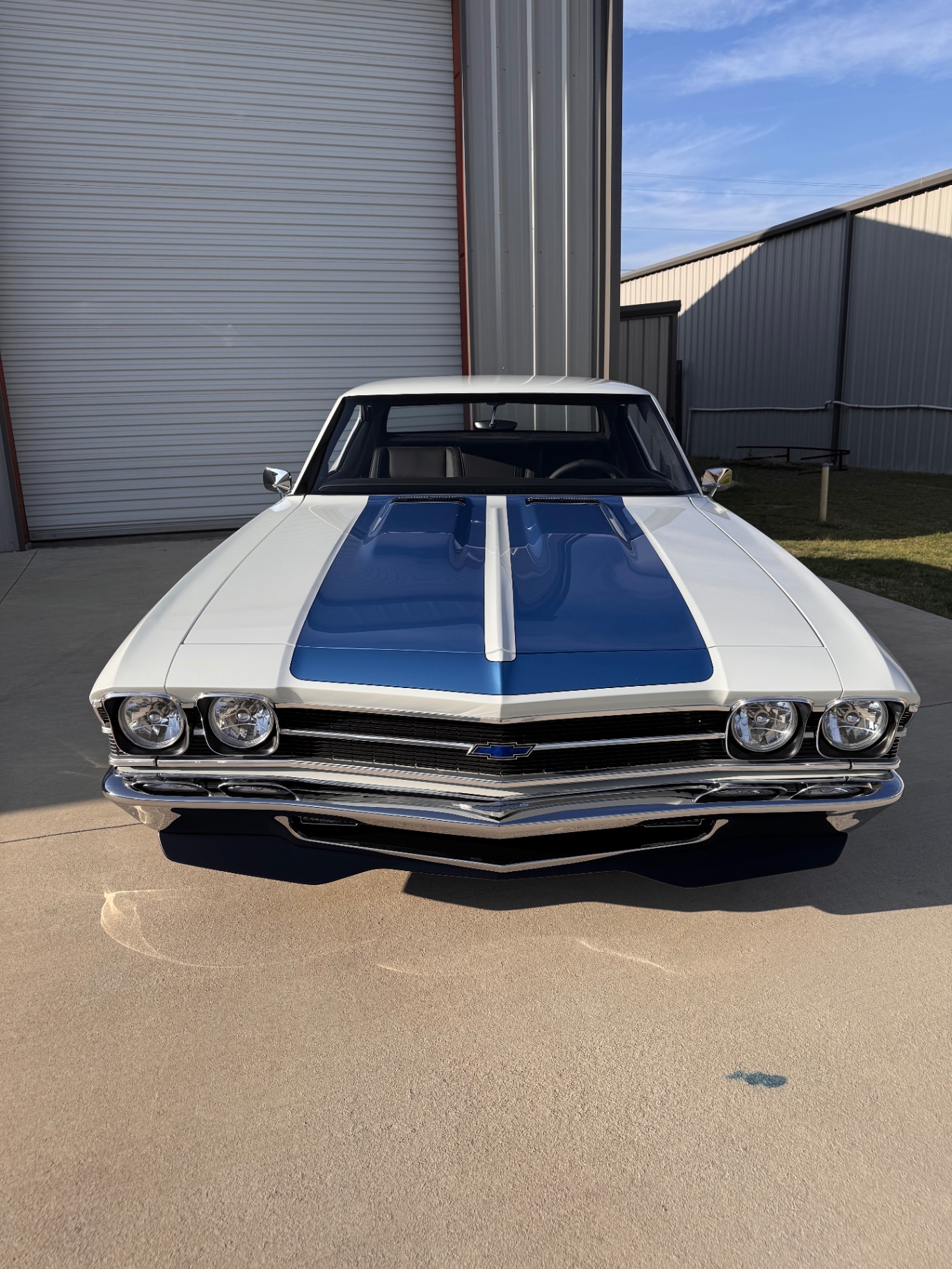 Straight-on front — grille, quad headlights, and stance.