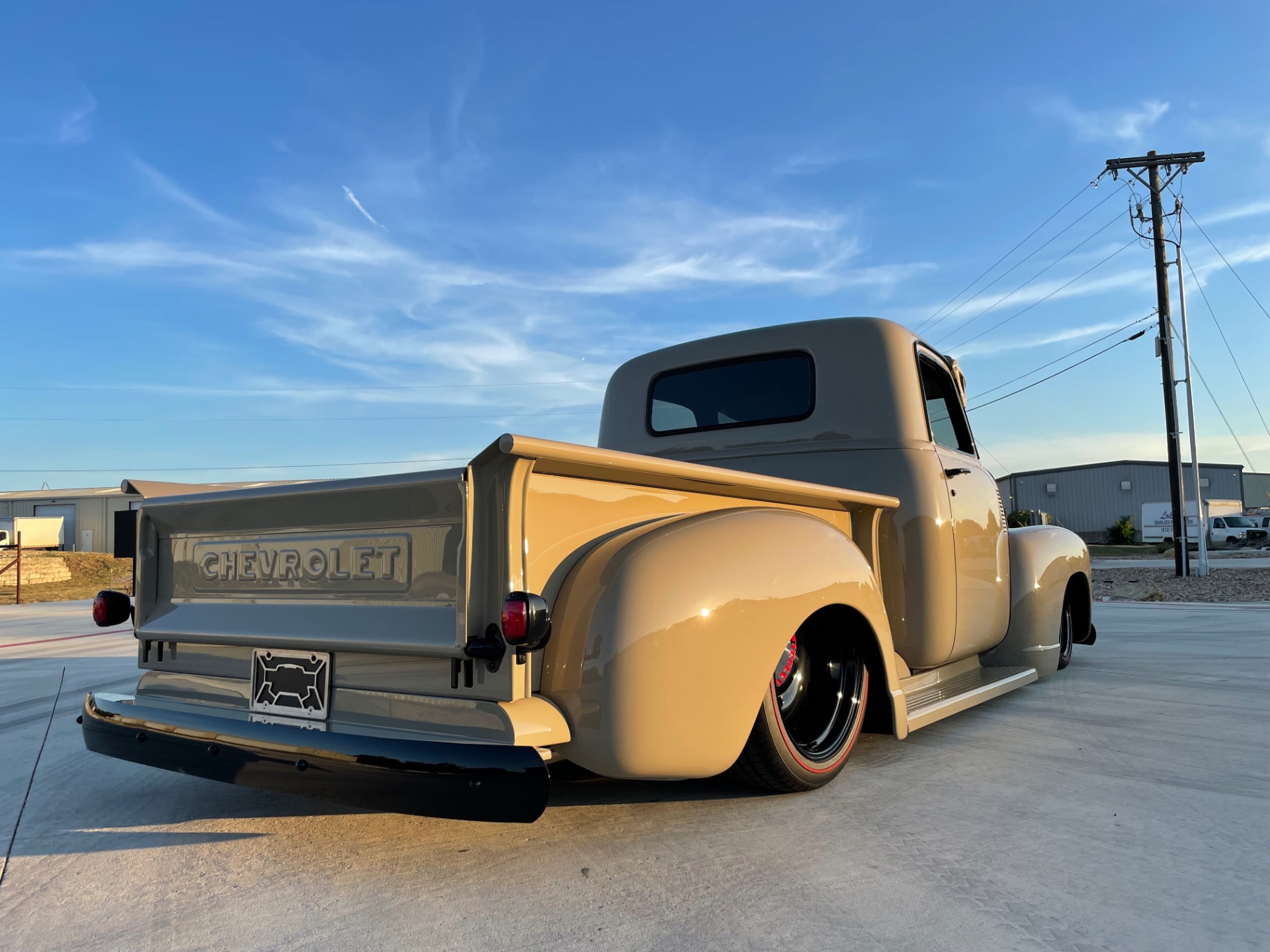 Rear three-quarter — bed, fender, and stance all telling the same story.