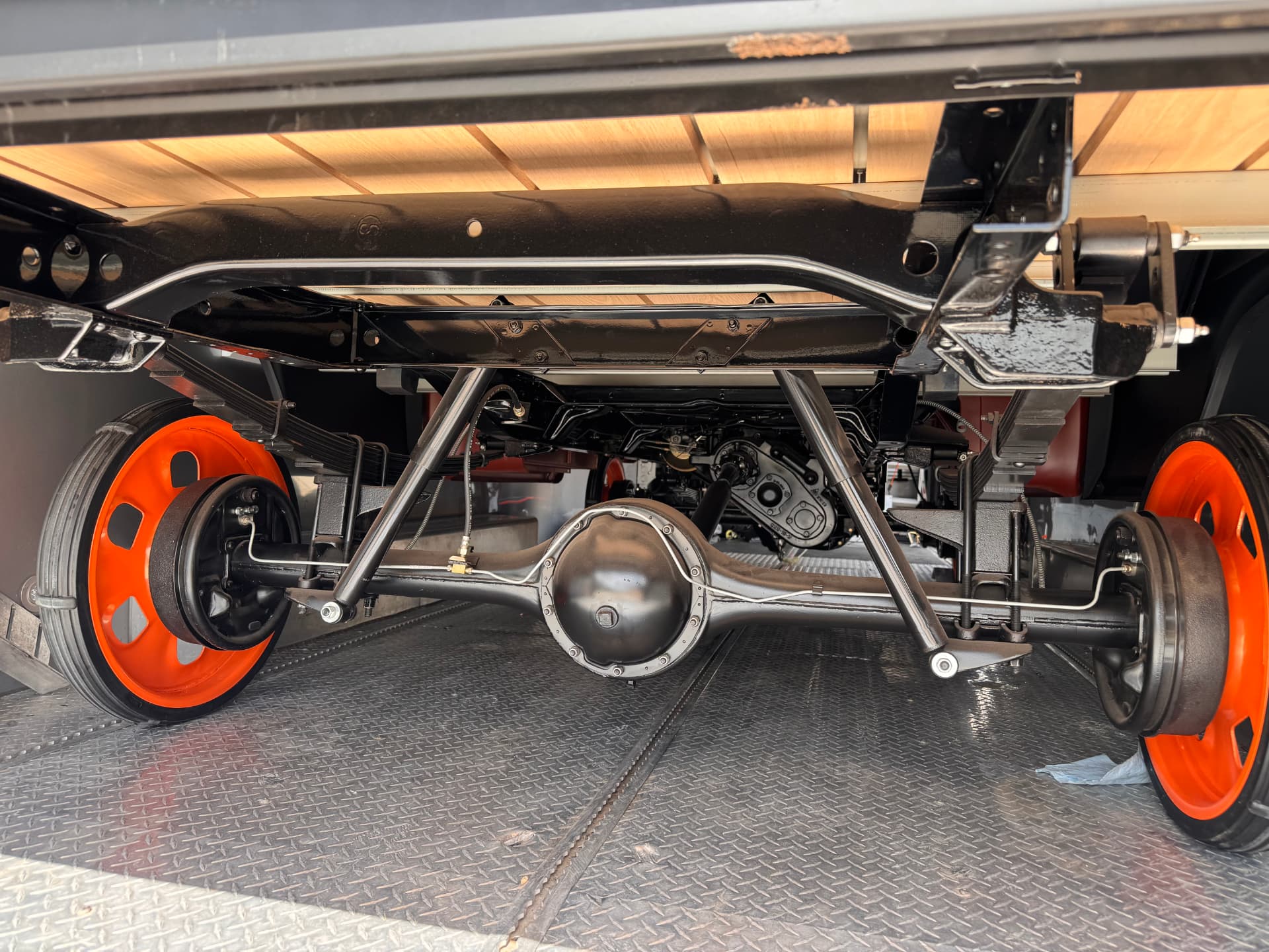 Underside on the trailer — frame, rear end, and hardware all fresh.