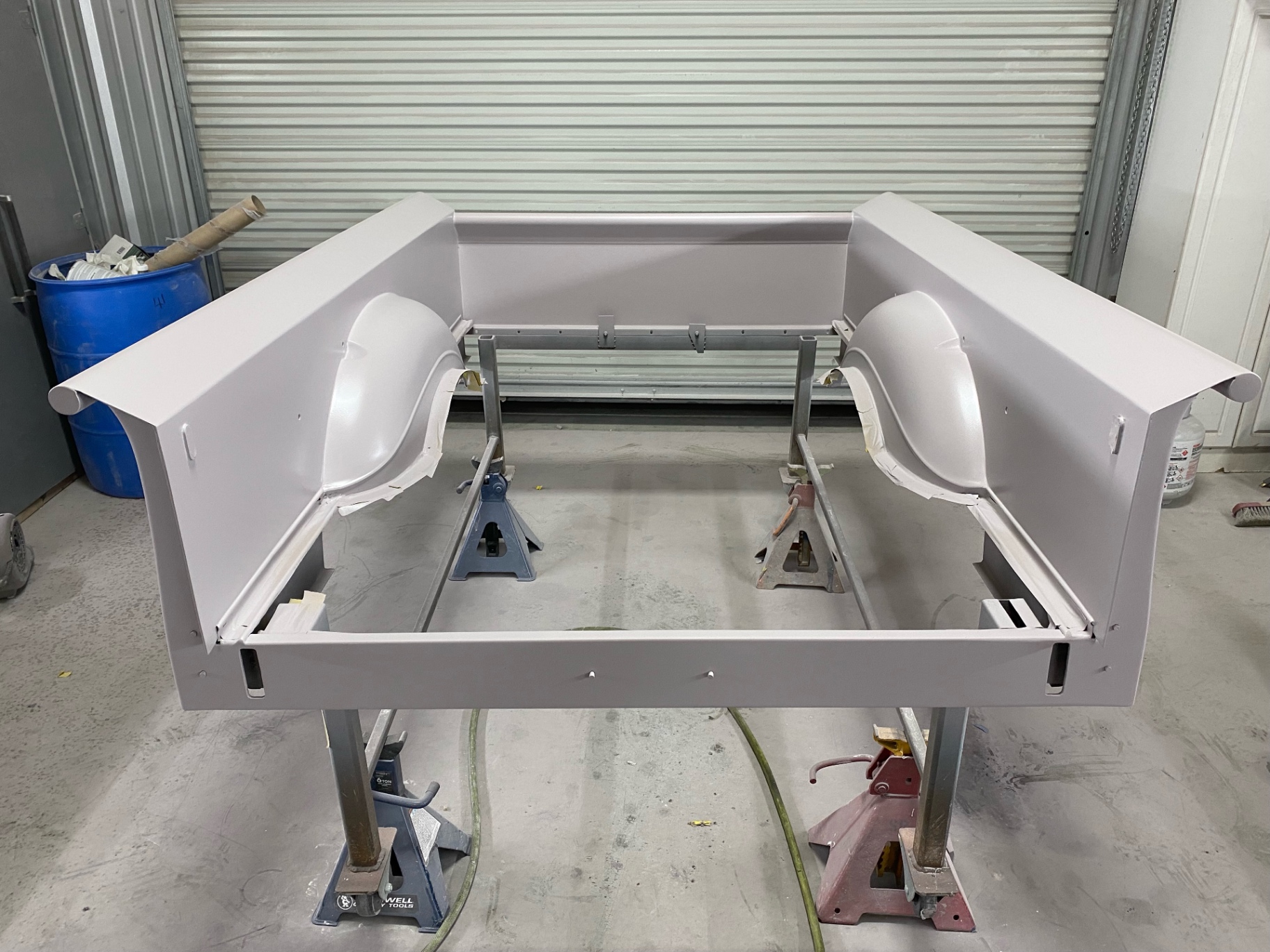 Bed box in sealer — inner tubs, floor, and sides shot as one unit.