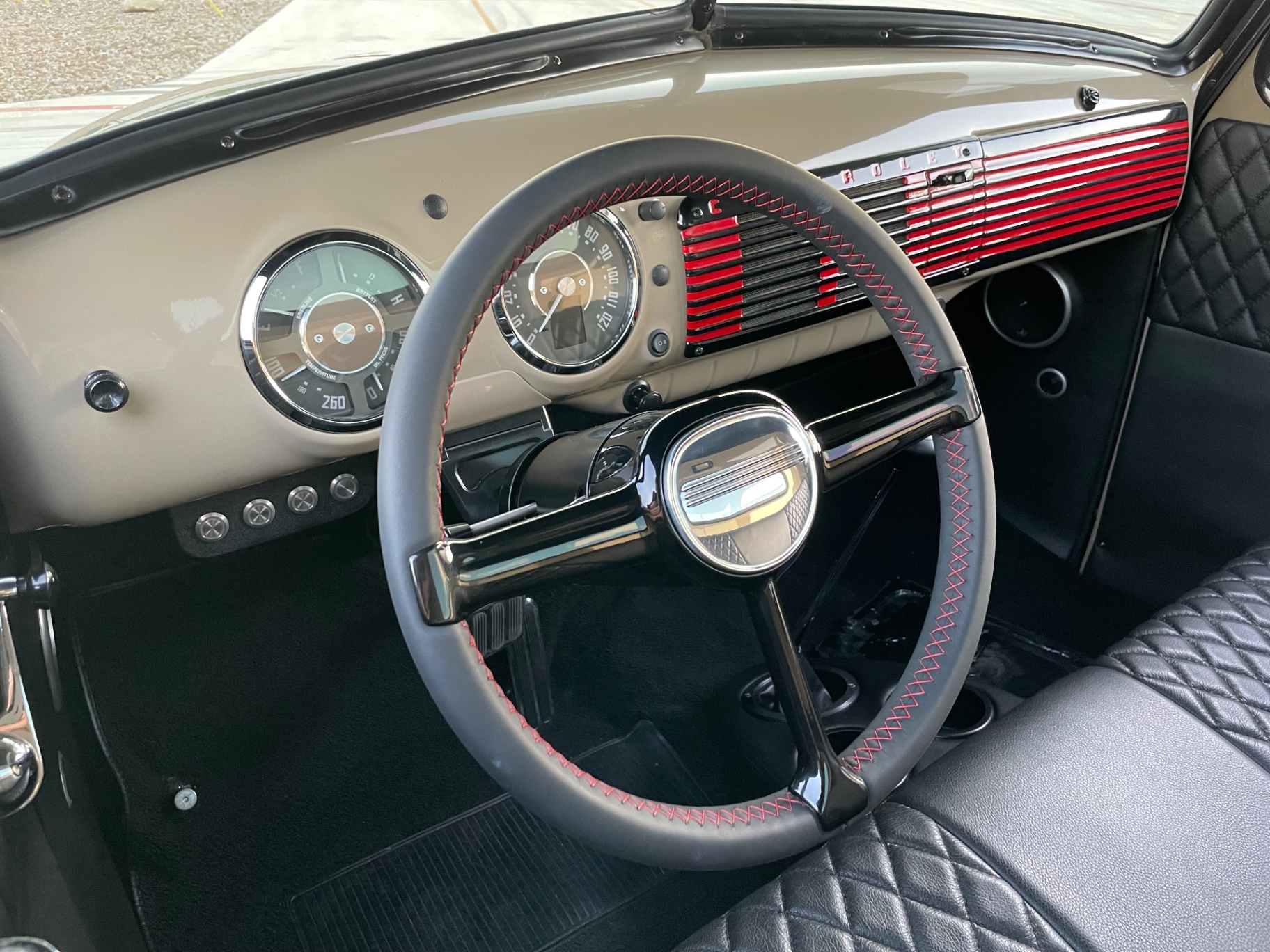 Driver seat view — Dakota Digital RTX gauges in the OE bezel, red-stitched Sparc Industries Billet wheel.