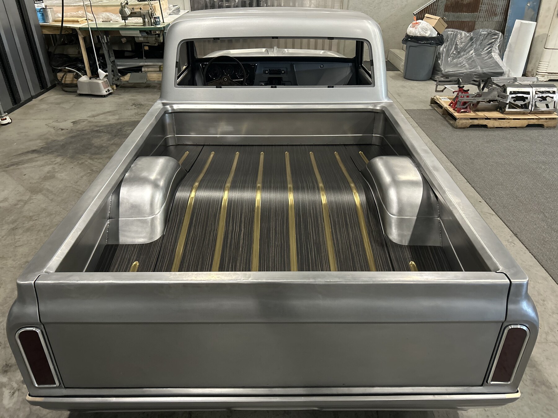 100% hand-fabricated bed with brass bed strips and billet tail lights.