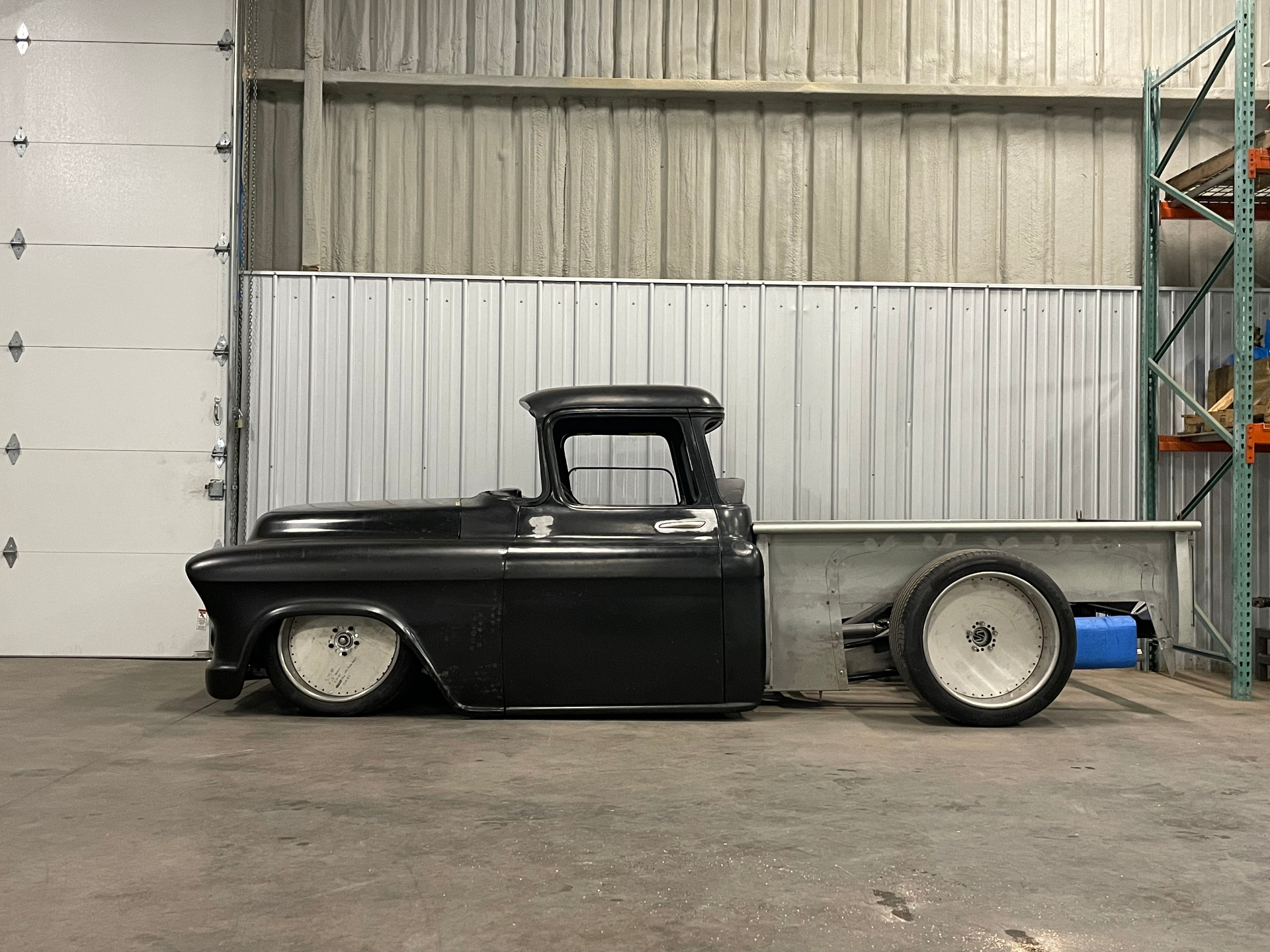 Full side profile showing the laid-out stance and bed mockup.