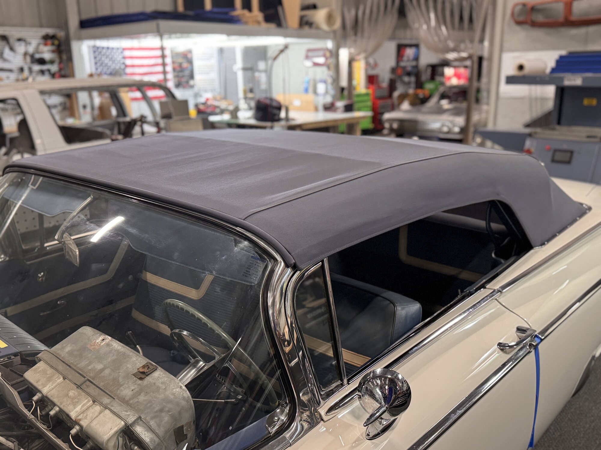 Finished canvas top on the '59 — tight across the bows with the header bow and stainless trim back in place