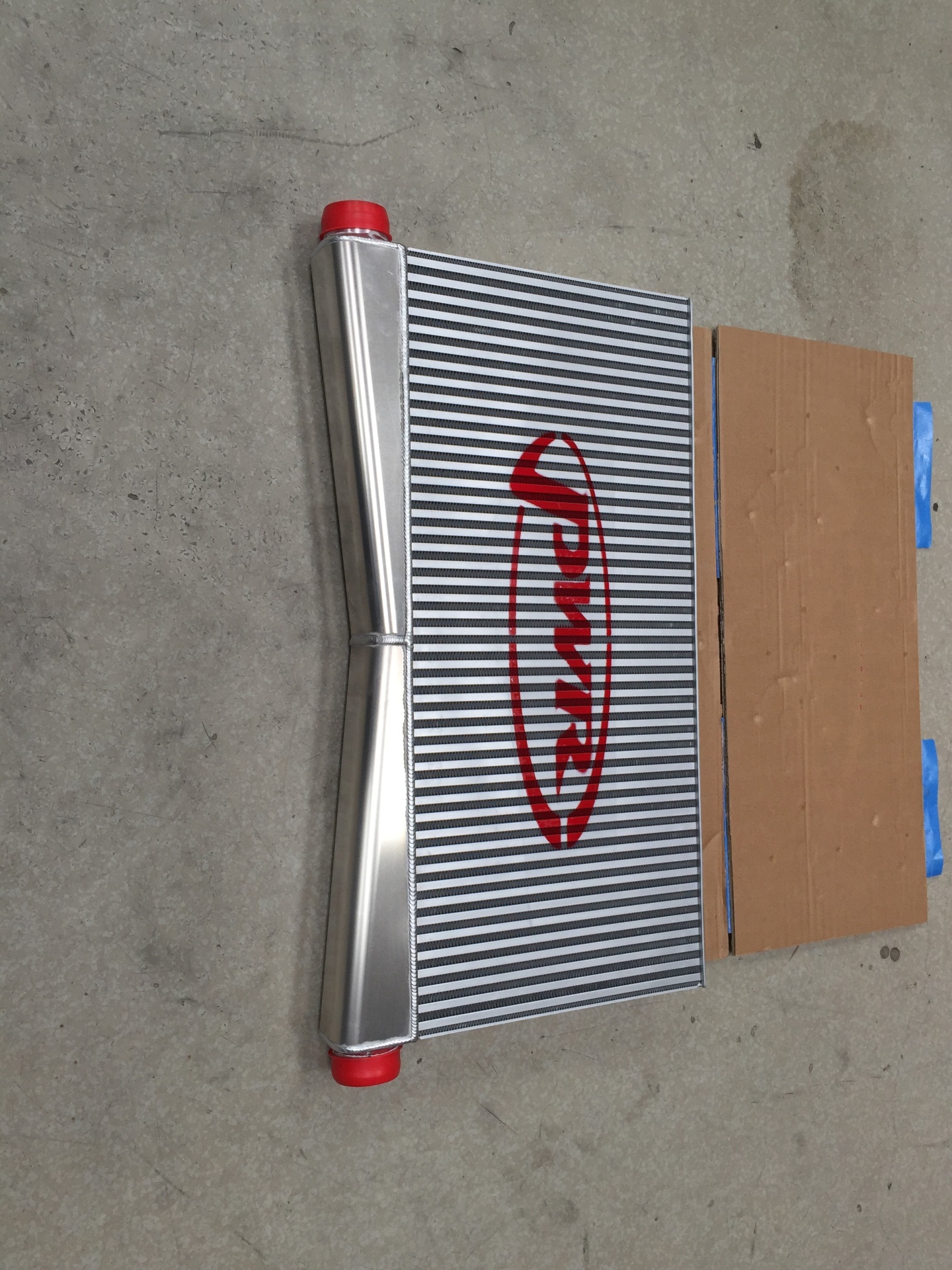 The custom PWR bar-and-plate intercooler on the shop floor.
